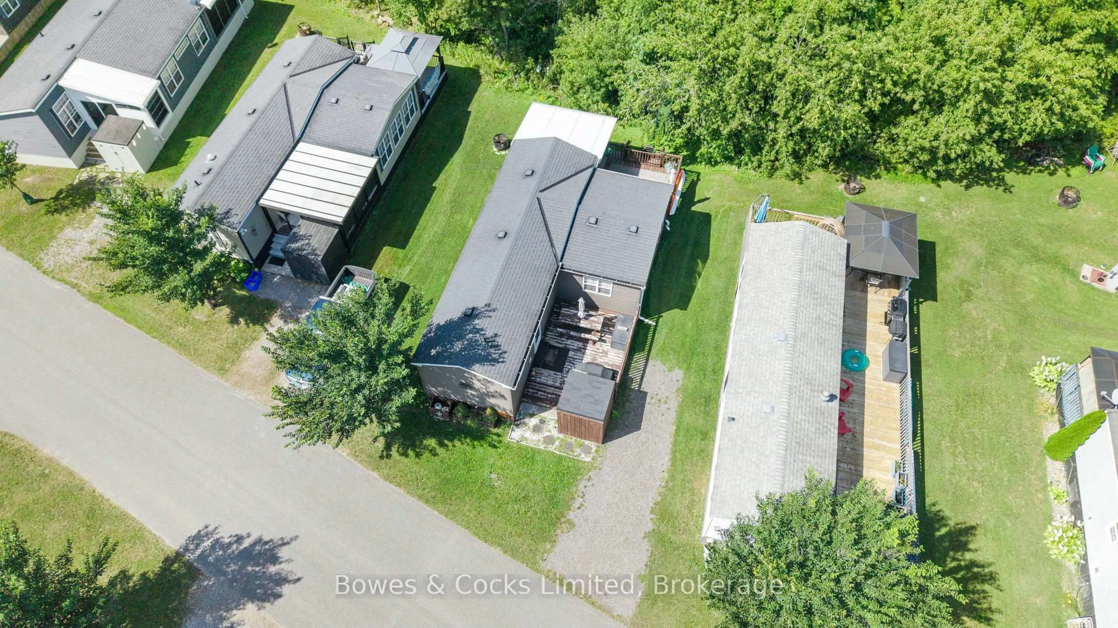 A pic from outside/outdoor area/front of a property/back of a property/a pic from drone, street for 1235 Villiers Line #15 The Point Dr., Otonabee-South Monaghan Ontario K0L 2G0