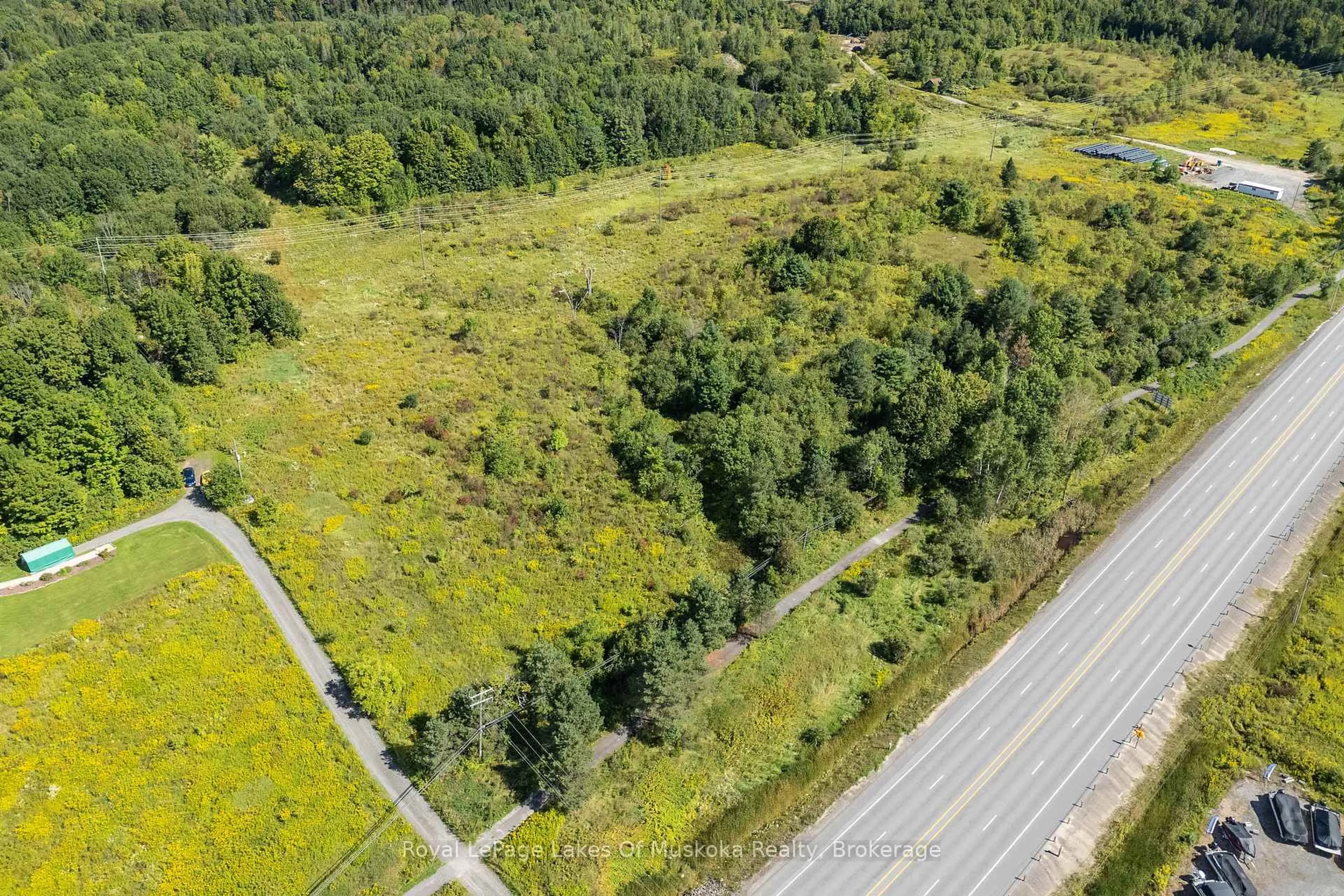 A pic from outside/outdoor area/front of a property/back of a property/a pic from drone, forest/trees view for 382 60 Highway, Huntsville Ontario P1H 1B6