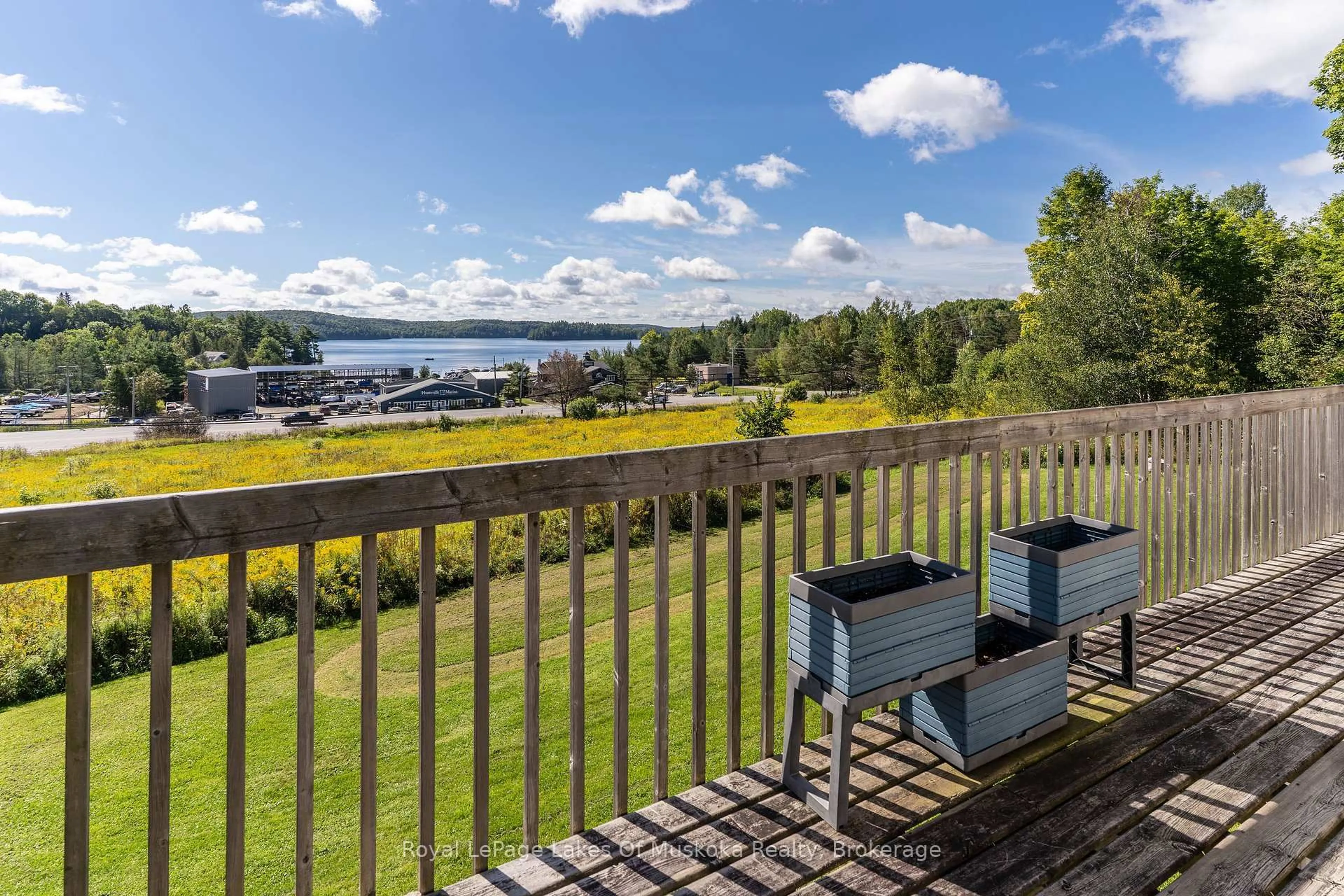 A pic from outside/outdoor area/front of a property/back of a property/a pic from drone, water/lake/river/ocean view for 382 60 Highway, Huntsville Ontario P1H 1B6
