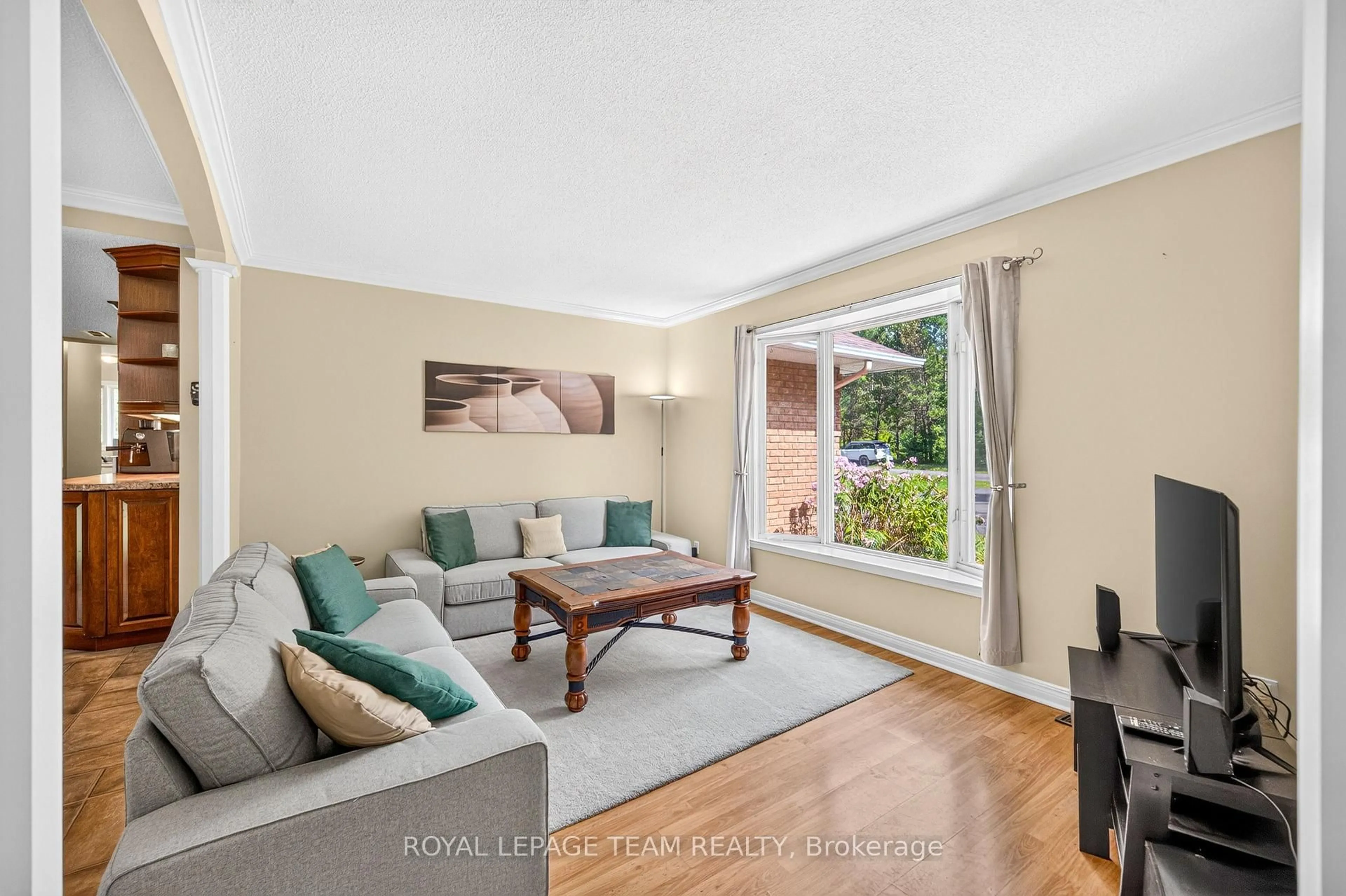 Living room with furniture, wood/laminate floor for 2506 Rollin Rd, Clarence-Rockland Ontario K0A 3N0