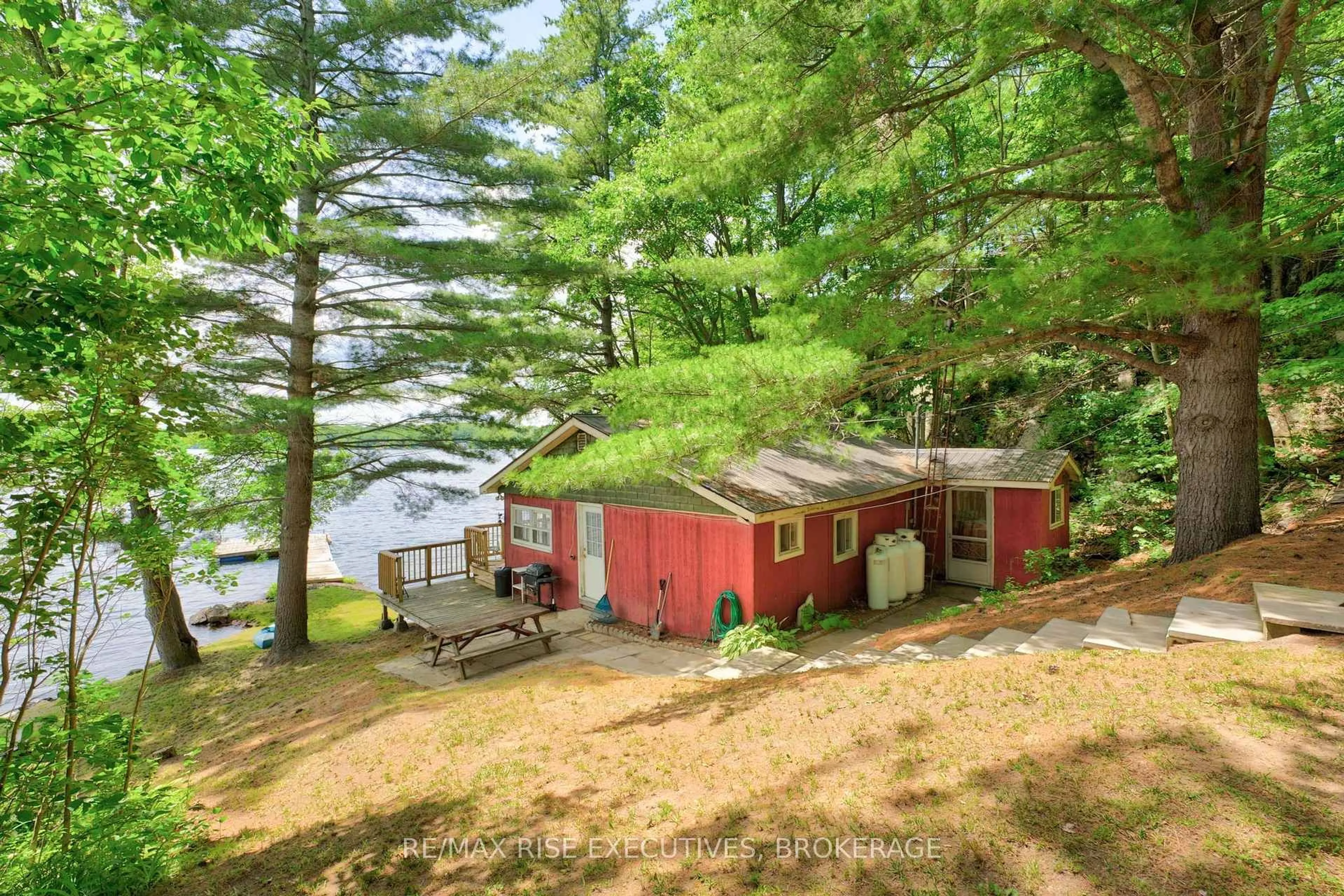 A pic from outside/outdoor area/front of a property/back of a property/a pic from drone, water/lake/river/ocean view for 90 East Shore Lane, Tichborne Ontario K0H 2V0