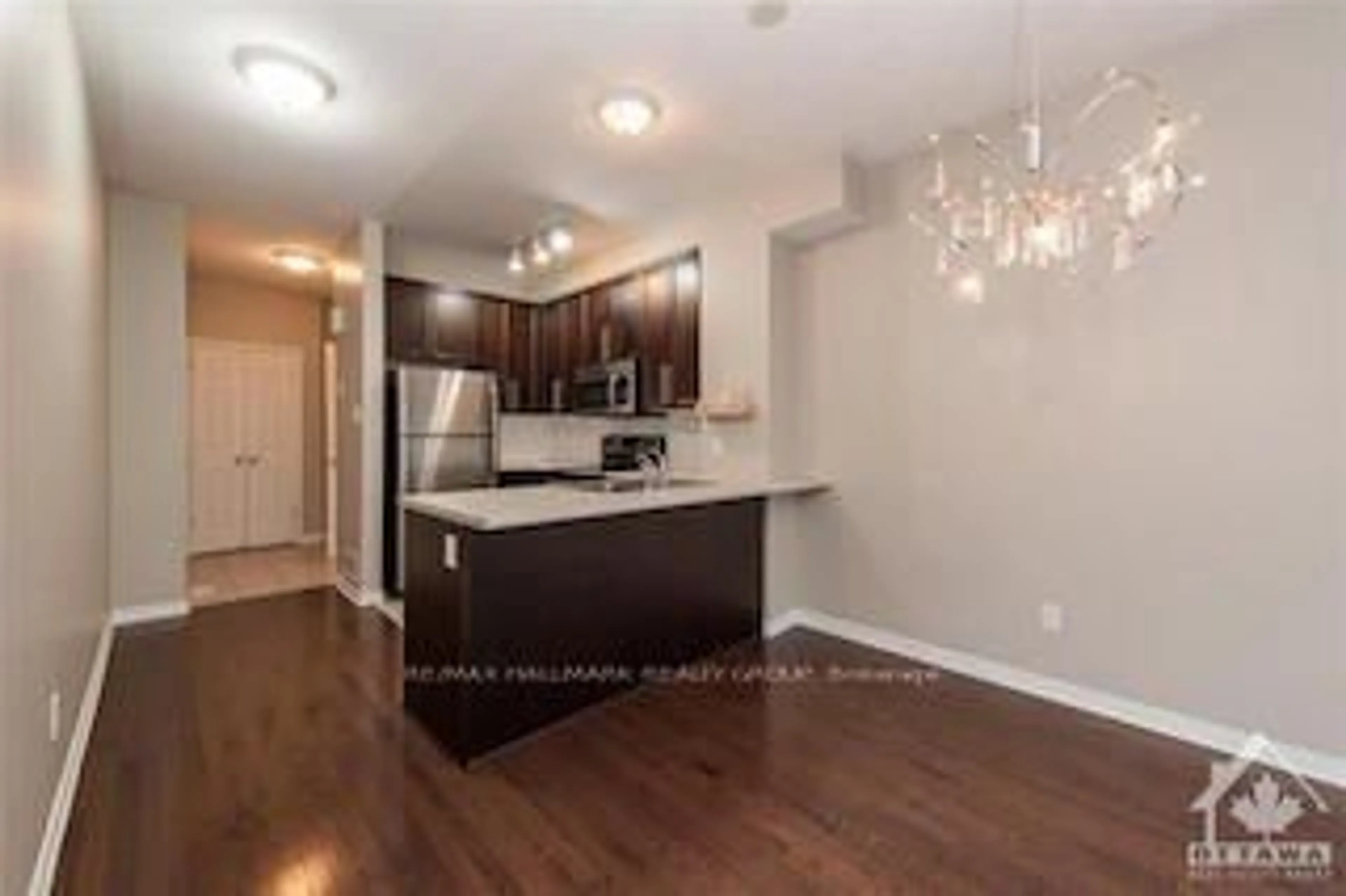 Open concept kitchen, wood/laminate floor for 49 Jardin Private #337, Ottawa Ontario K1K 2V8