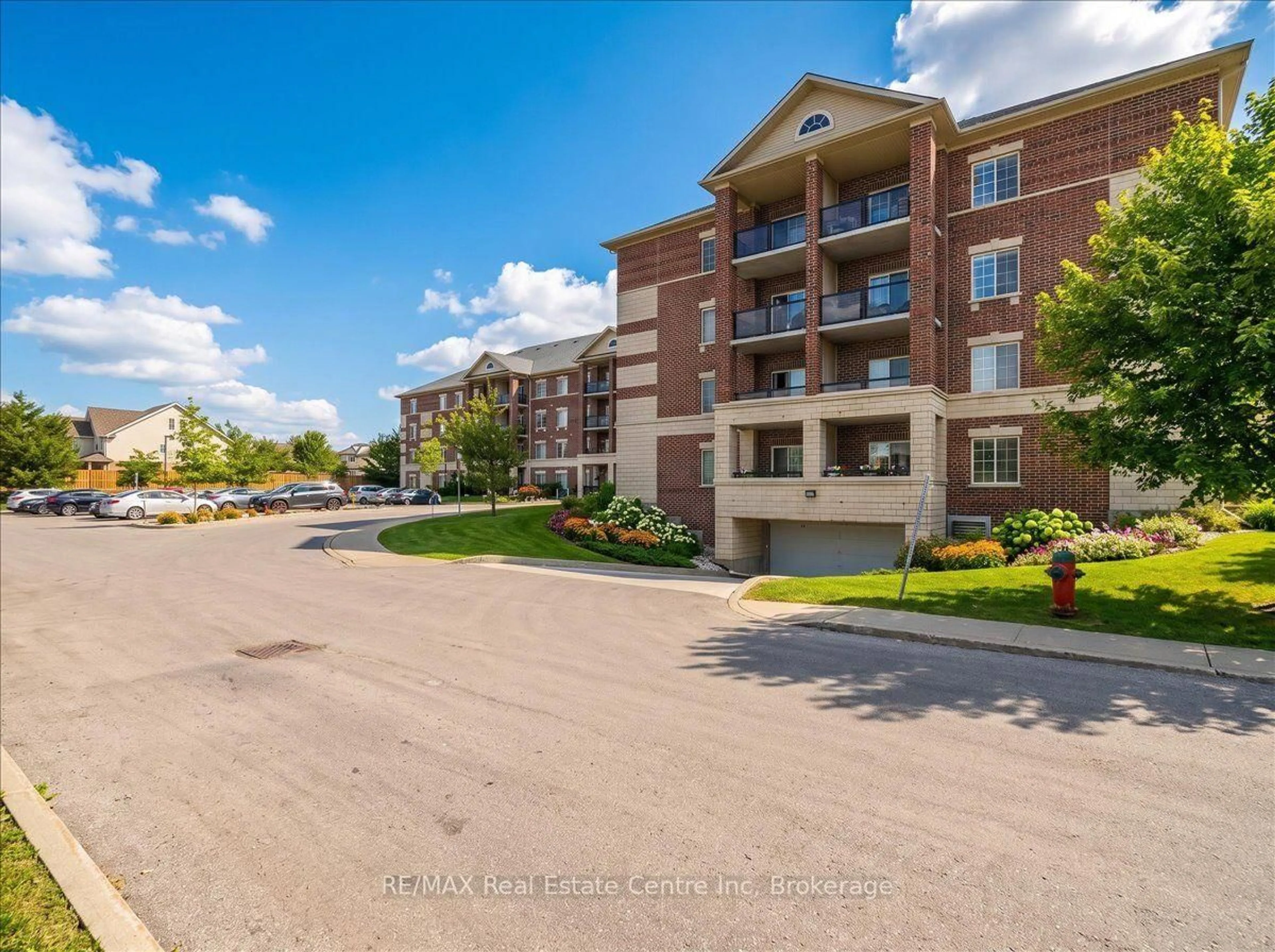 A pic from outside/outdoor area/front of a property/back of a property/a pic from drone, water/lake/river/ocean view for 308 Watson Pkwy #205, Guelph Ontario N1E 0G7