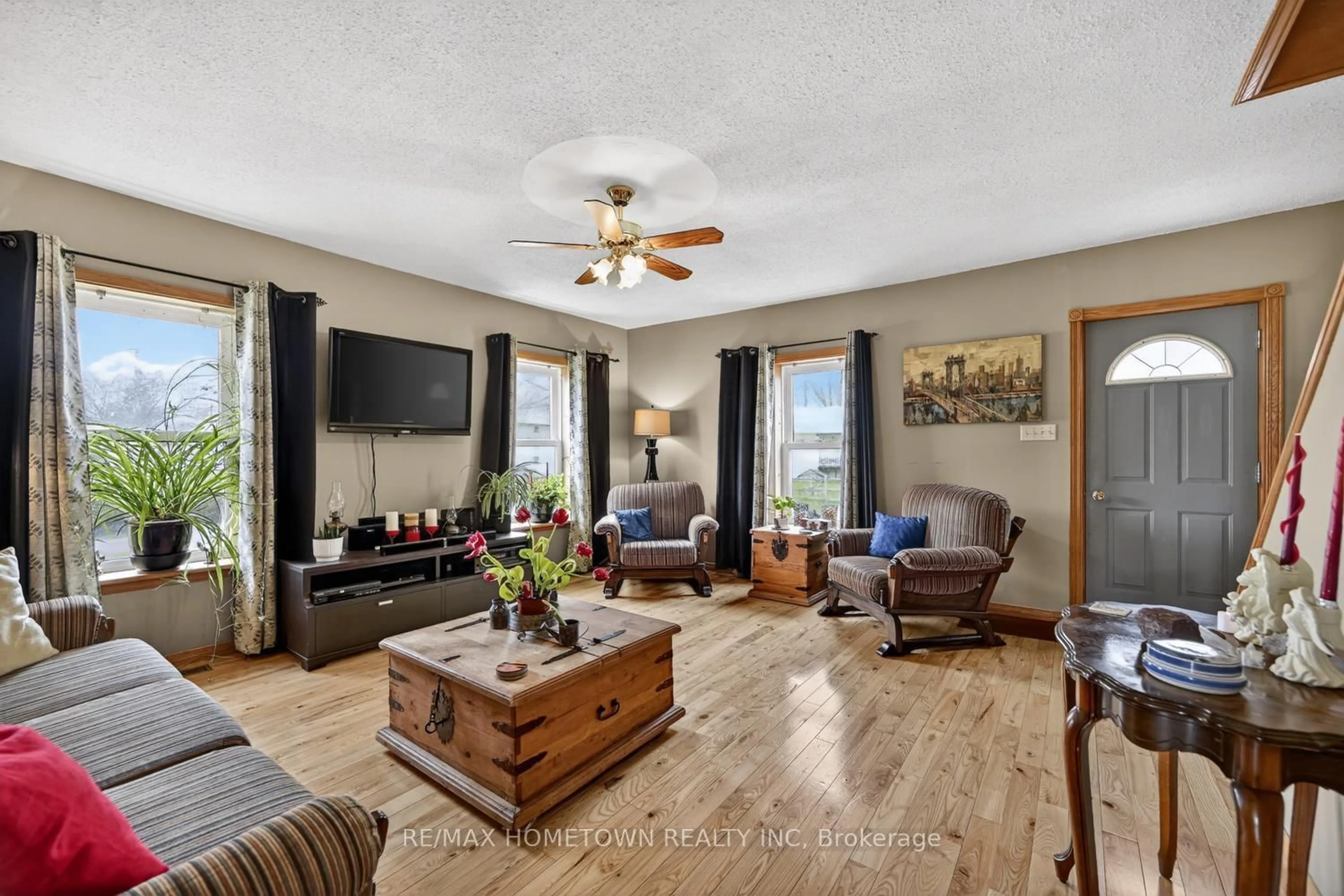 Living room with furniture, wood/laminate floor for 12402 County Road 18 Rd, South Dundas Ontario K0C 2H0