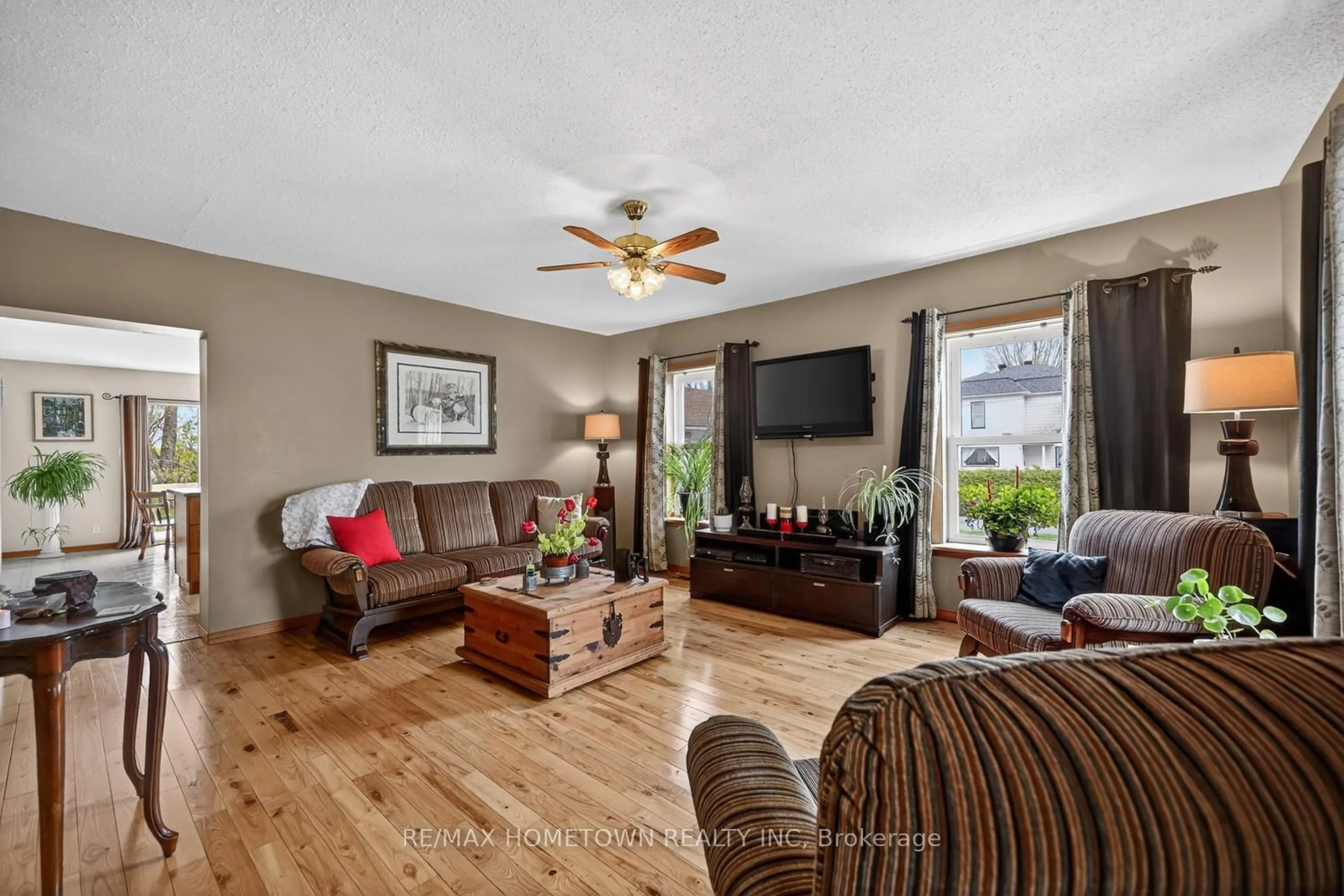 Living room with furniture, wood/laminate floor for 12402 County Road 18 Rd, South Dundas Ontario K0C 2H0