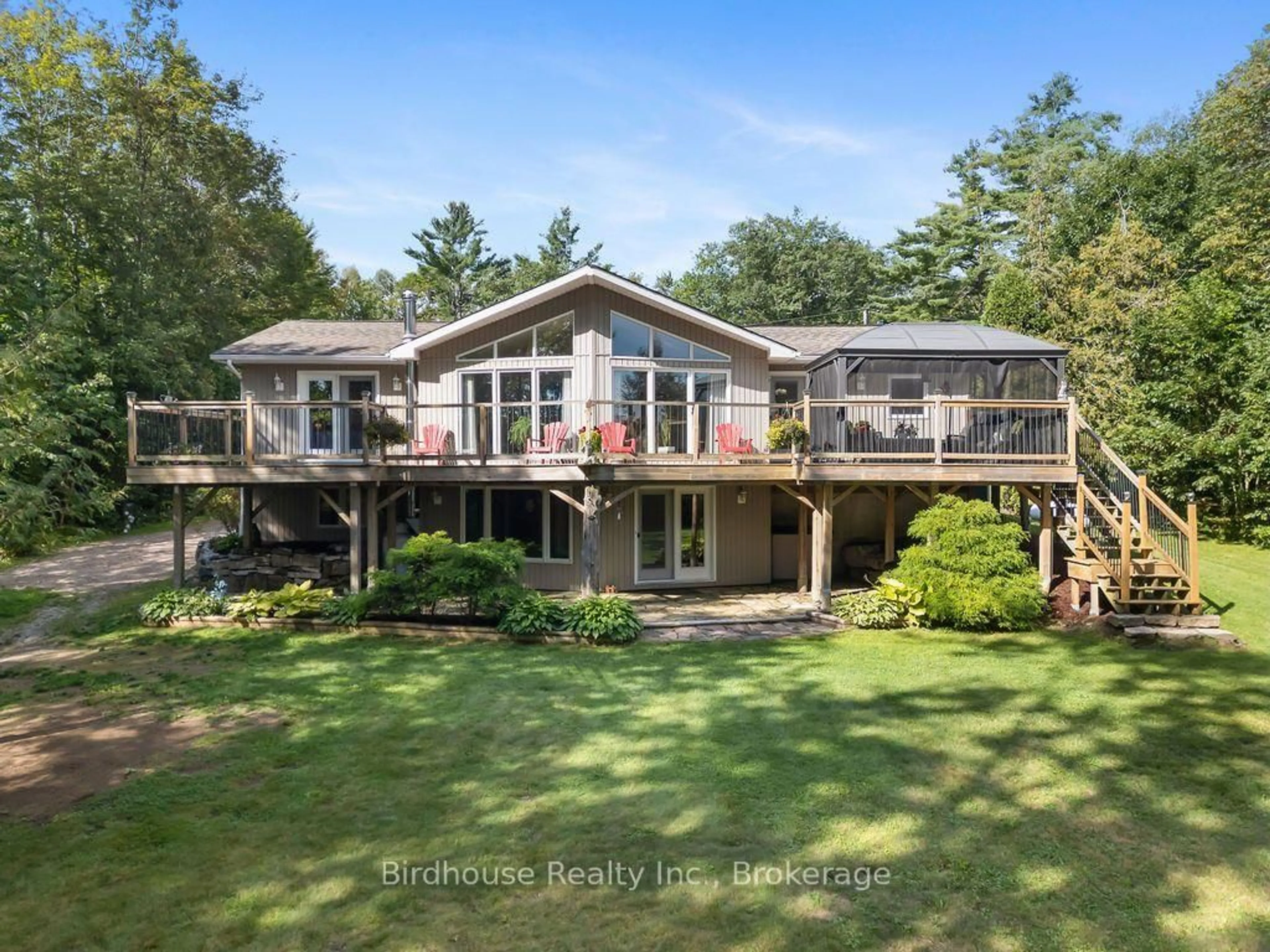 A pic from outside/outdoor area/front of a property/back of a property/a pic from drone, water/lake/river/ocean view for 1022 Mulberry Lane, Minden Hills Ontario K0M 2L1