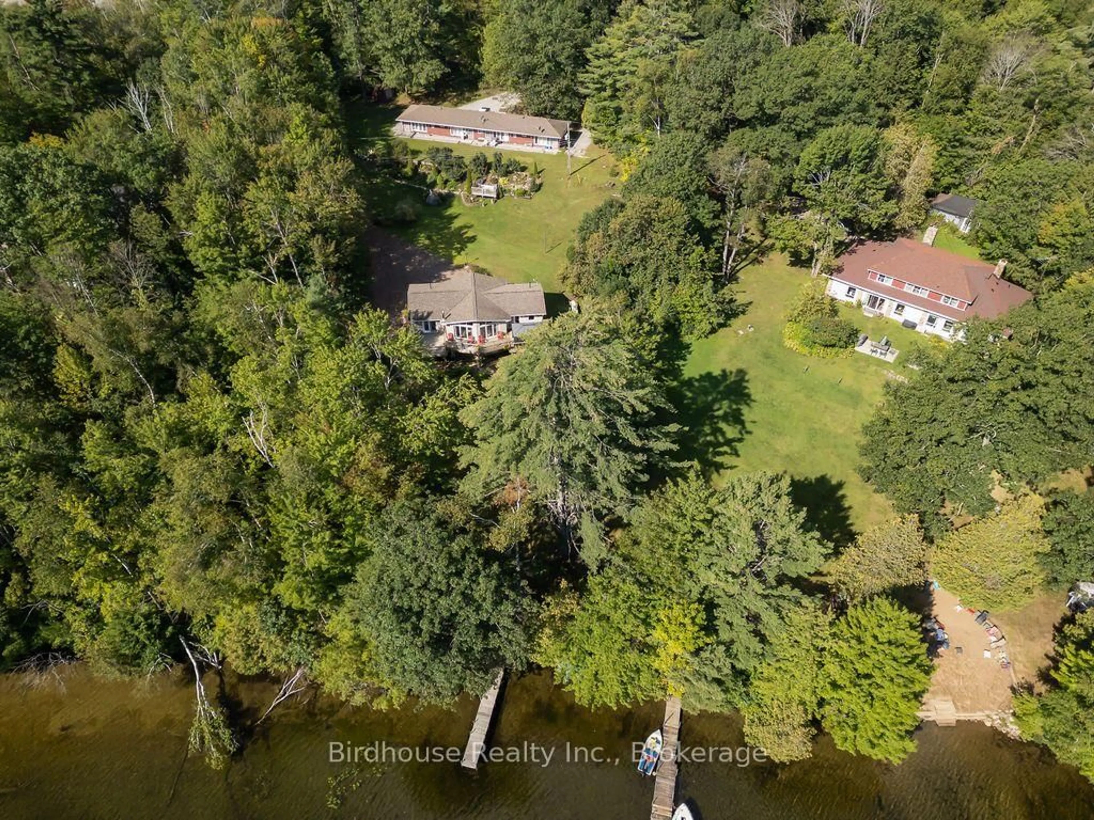 A pic from outside/outdoor area/front of a property/back of a property/a pic from drone, water/lake/river/ocean view for 1022 Mulberry Lane, Minden Hills Ontario K0M 2L1