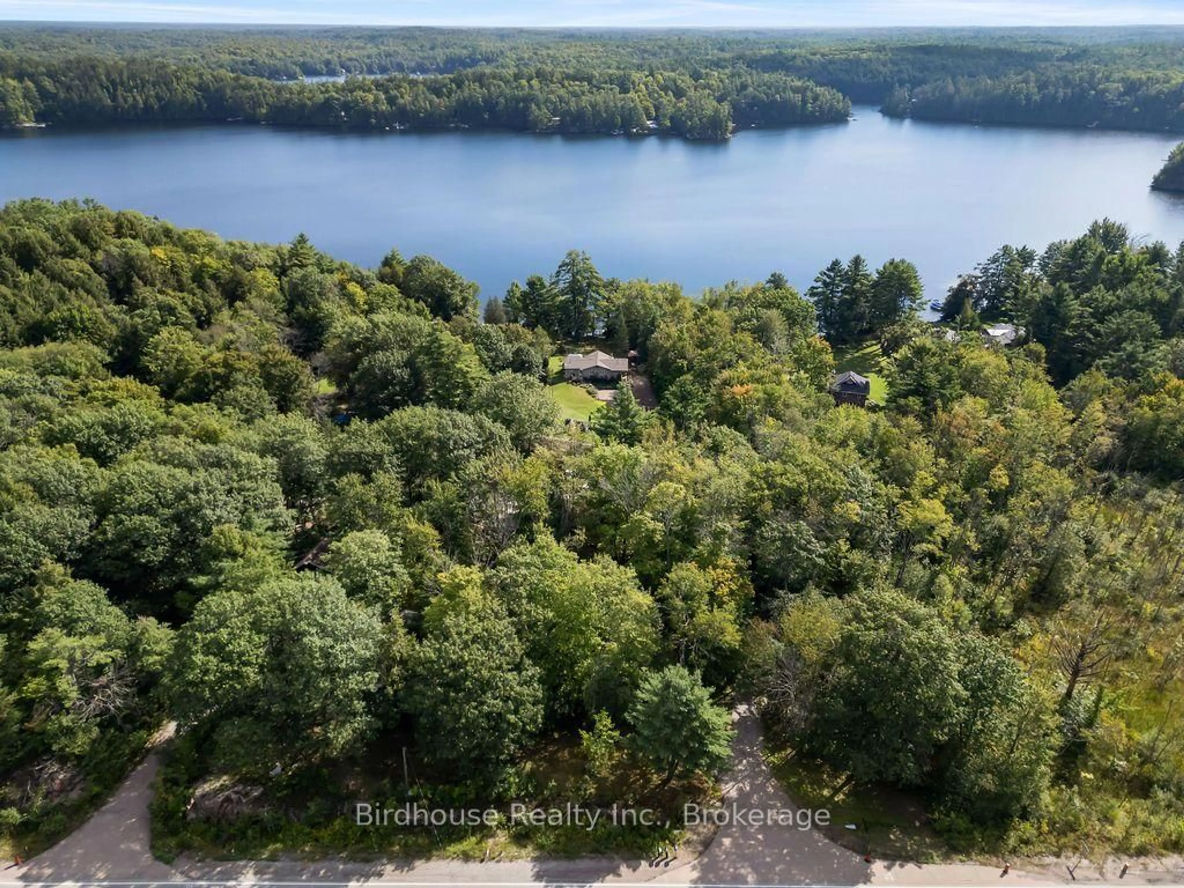 A pic from outside/outdoor area/front of a property/back of a property/a pic from drone, water/lake/river/ocean view for 1022 Mulberry Lane, Minden Hills Ontario K0M 2L1