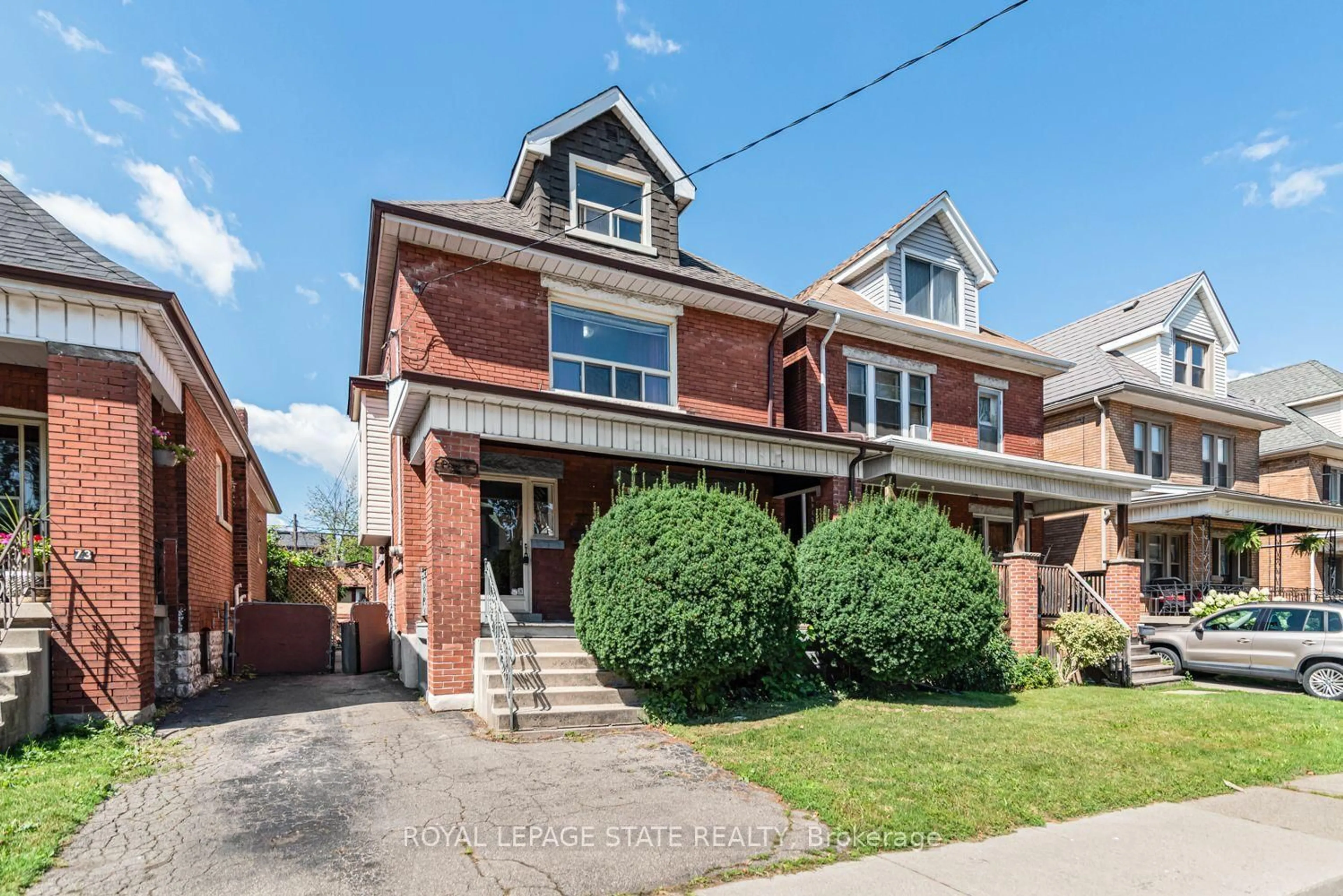 Home with brick exterior material, street for 75 Kensington Ave, Hamilton Ontario L8L 7N3