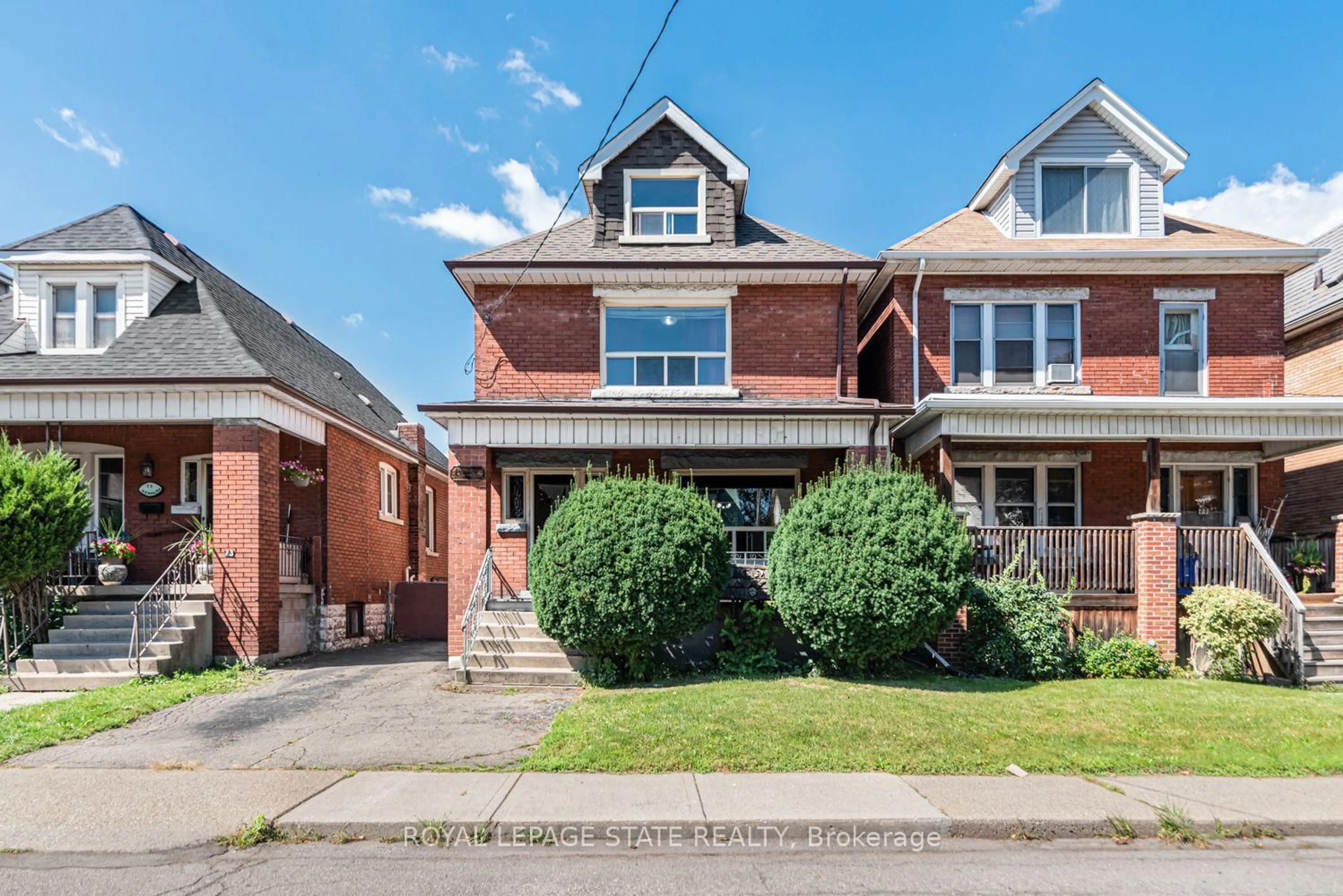 Home with brick exterior material, street for 75 Kensington Ave, Hamilton Ontario L8L 7N3