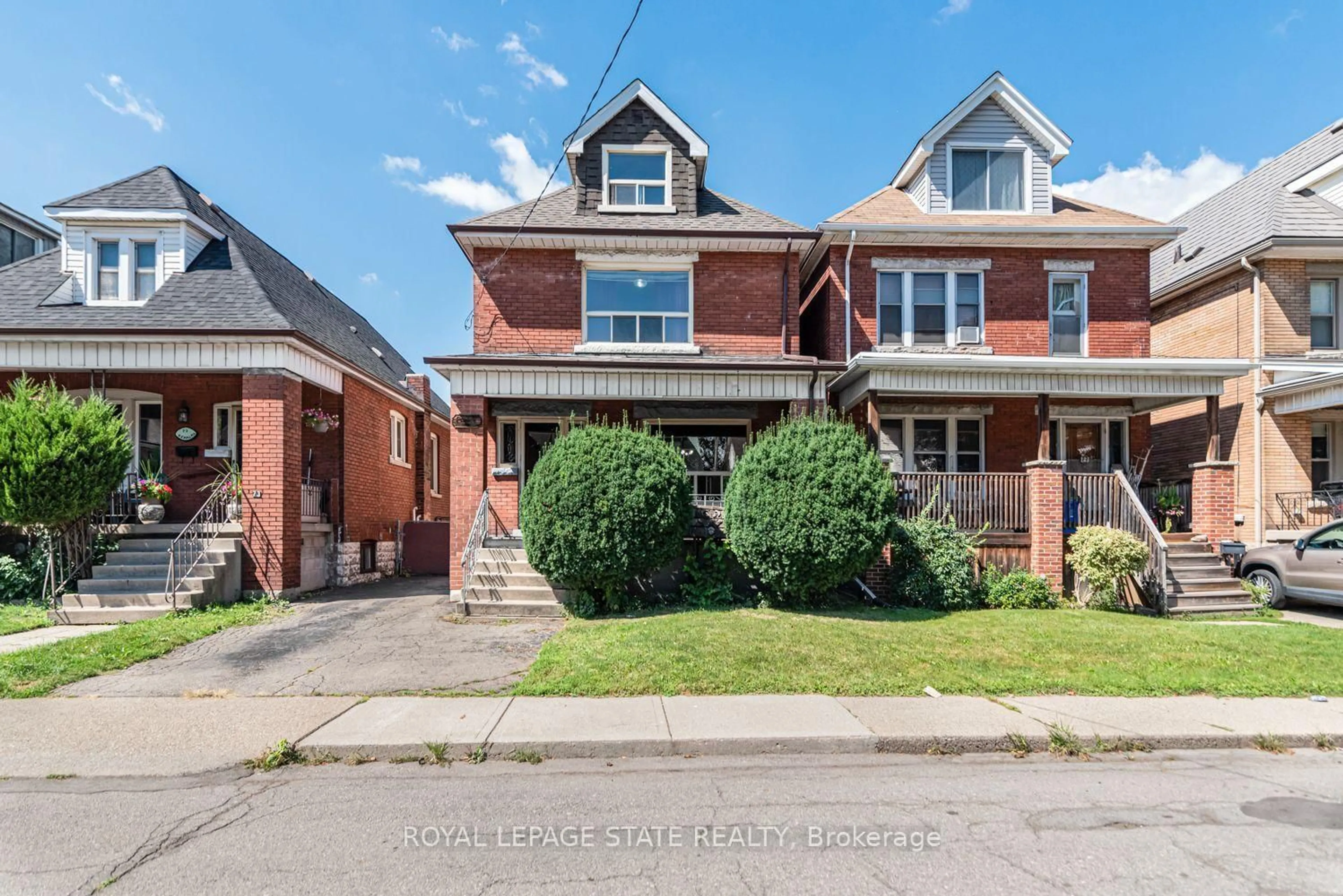 Home with brick exterior material, street for 75 Kensington Ave, Hamilton Ontario L8L 7N3