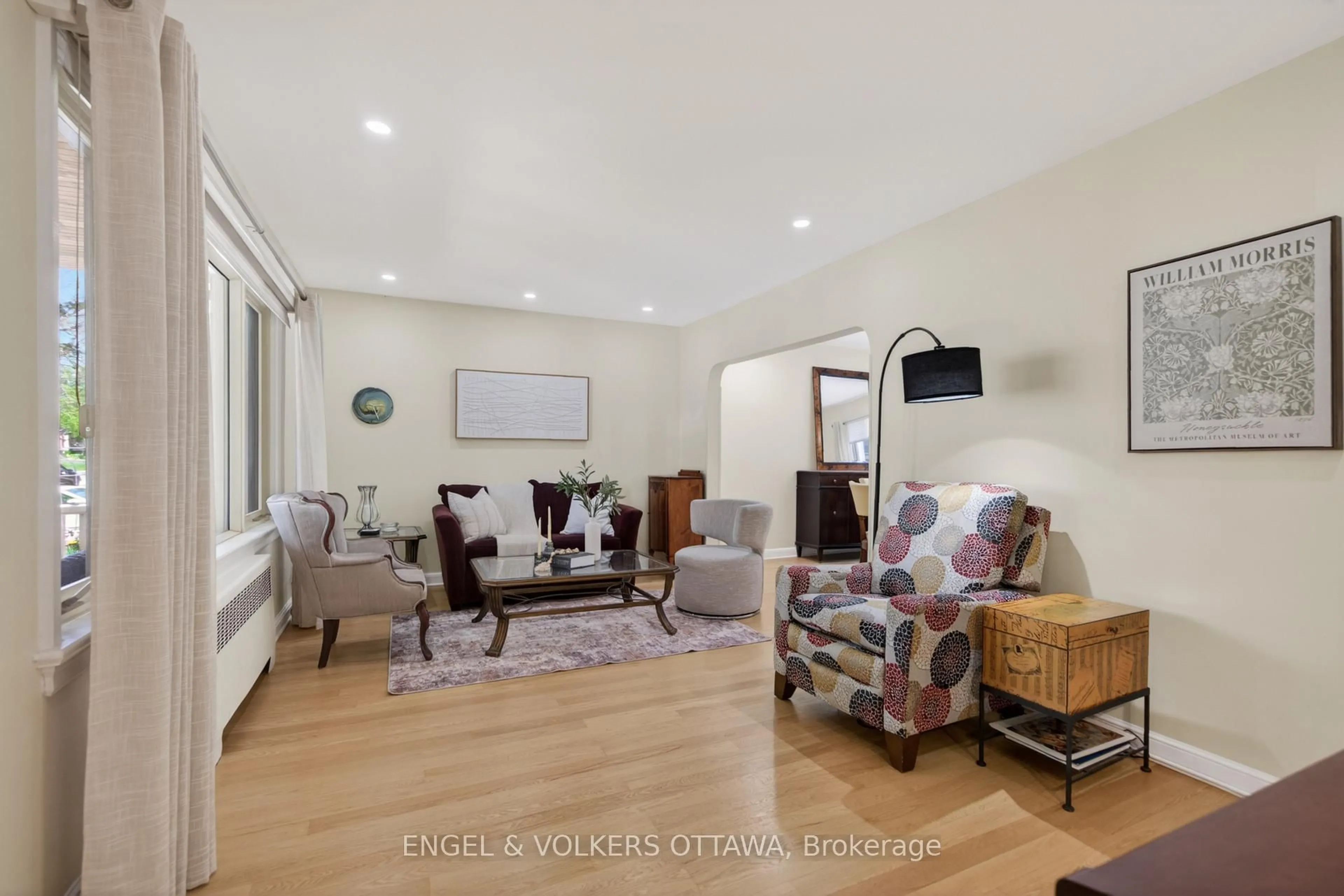 Living room with furniture, wood/laminate floor for 1396 Micmac St, Ottawa Ontario K1H 7N5