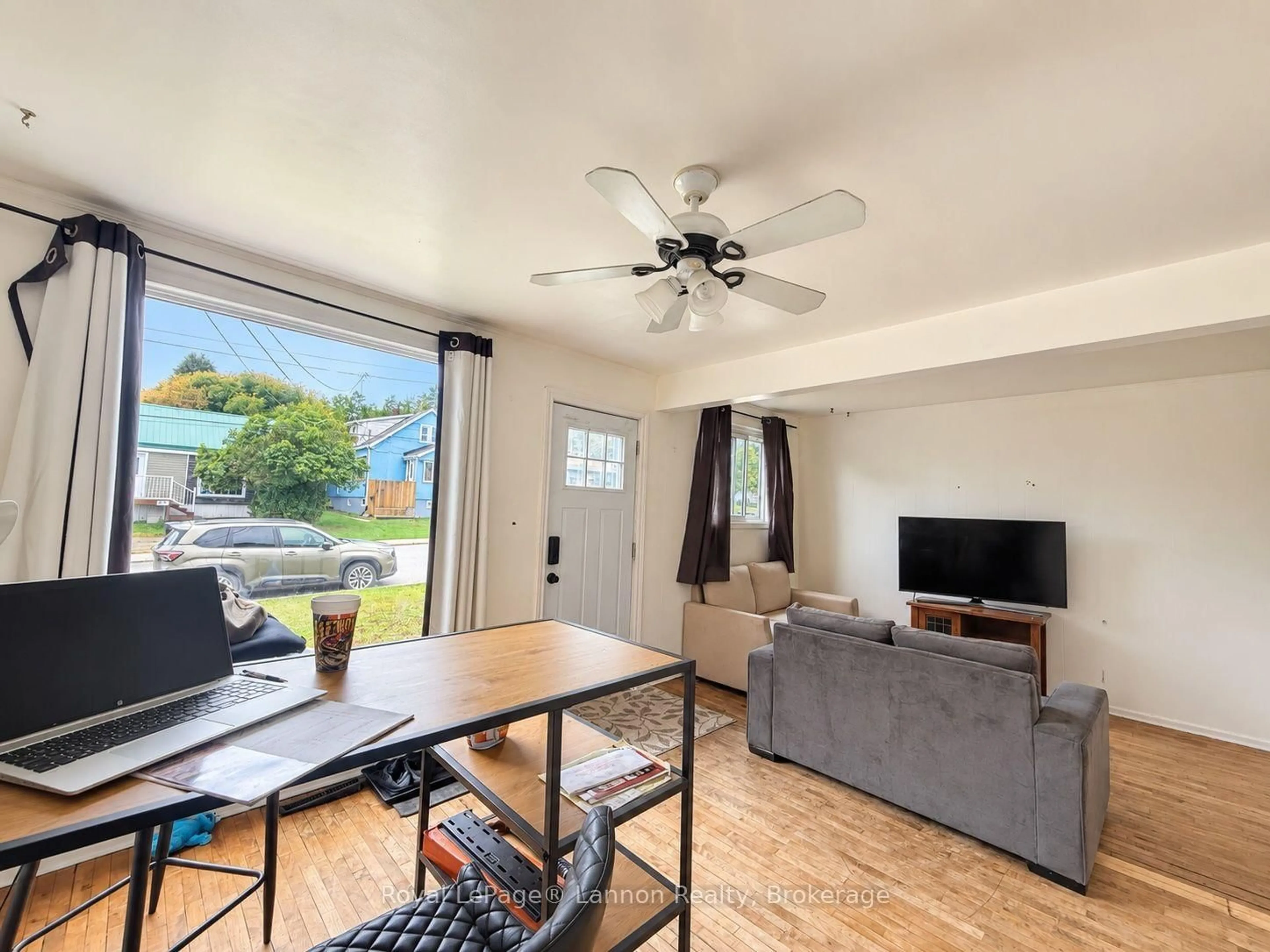 Living room with furniture, wood/laminate floor for 498 Grenville Ave, Thunder Bay Ontario P7A 2C4