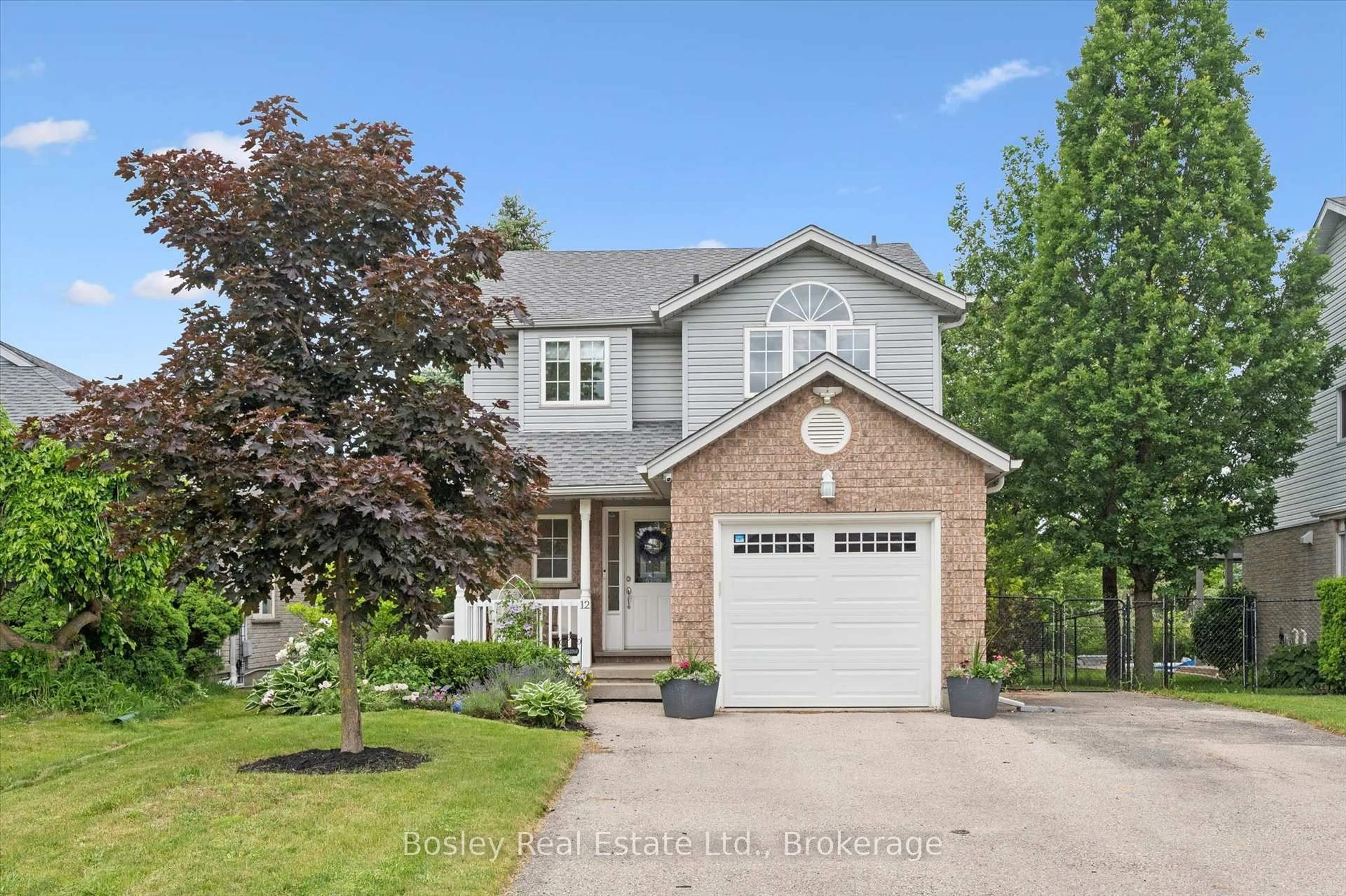 Home with brick exterior material, street for 12 Deerpath Dr, Guelph Ontario N1K 1T9