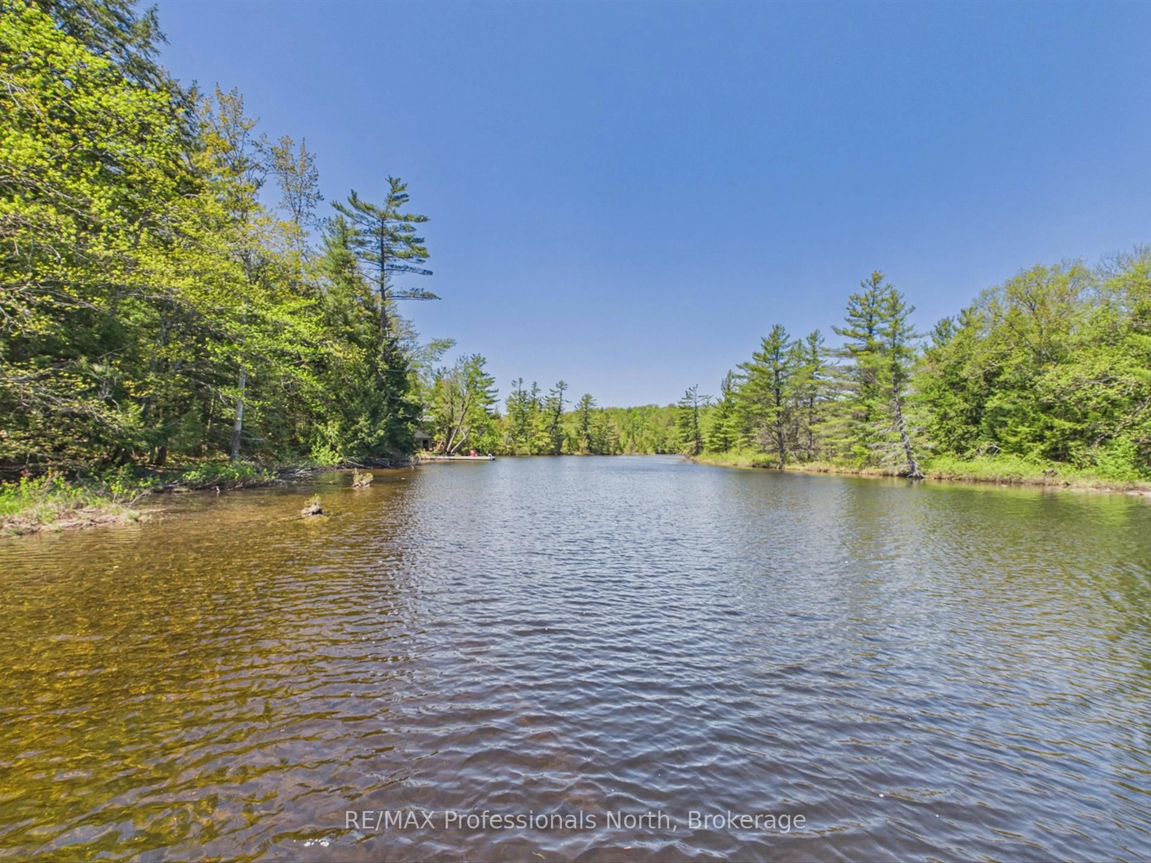 A pic from outside/outdoor area/front of a property/back of a property/a pic from drone, water/lake/river/ocean view for 1215 118 Highway, Bracebridge Ontario P1L 0K3