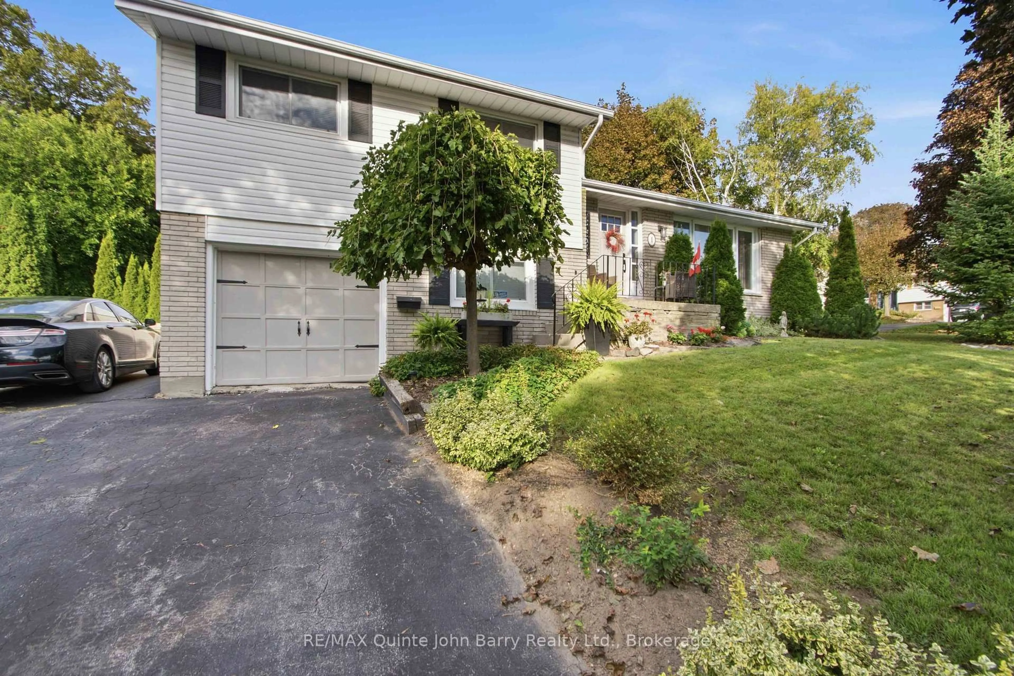 A pic from outside/outdoor area/front of a property/back of a property/a pic from drone, street for 1 Parkside Dr, Quinte West Ontario K8V 5L6