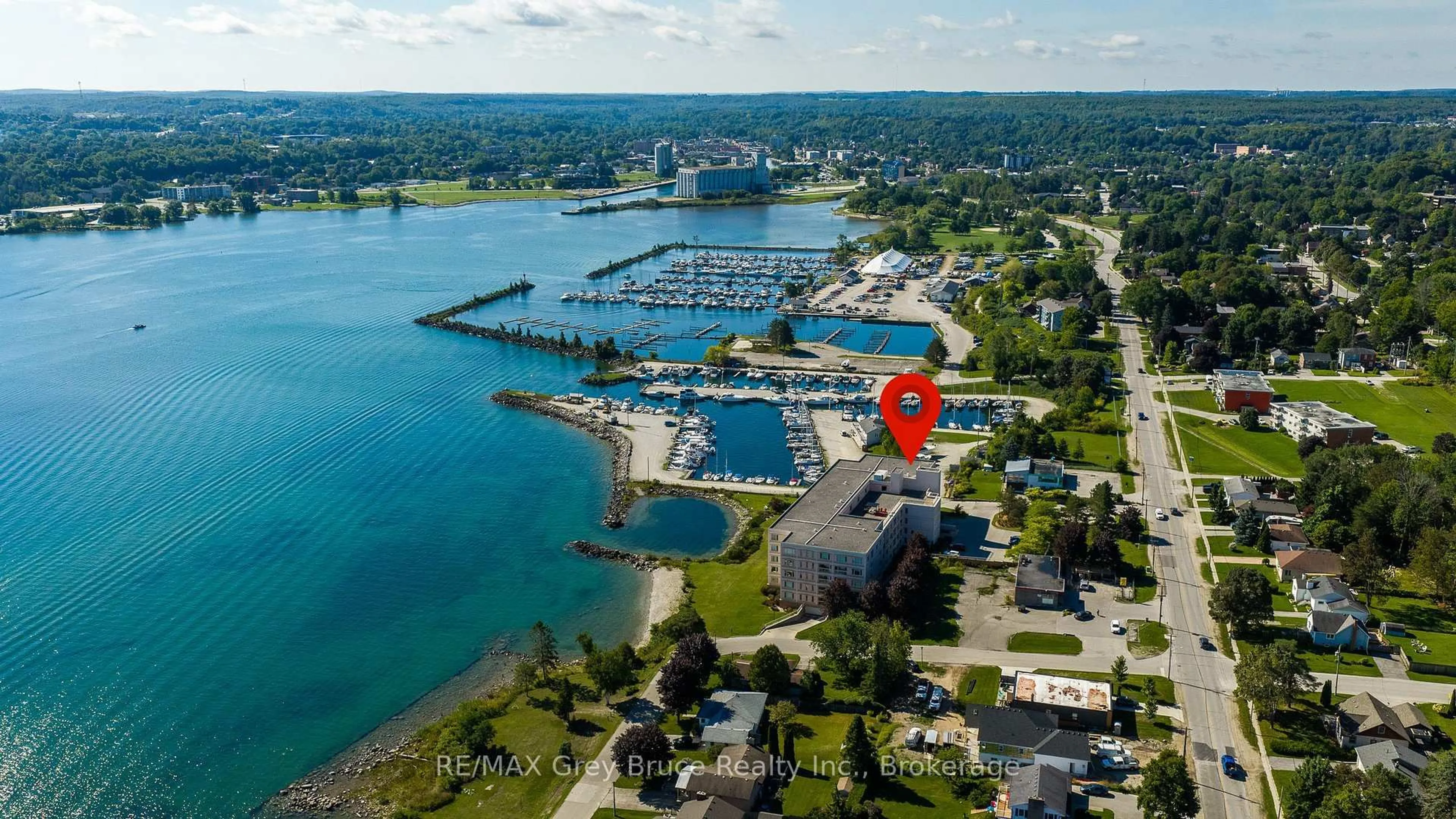 A pic from outside/outdoor area/front of a property/back of a property/a pic from drone, water/lake/river/ocean view for 2555 3rd Ave #310, Owen Sound Ontario N4K 6T8