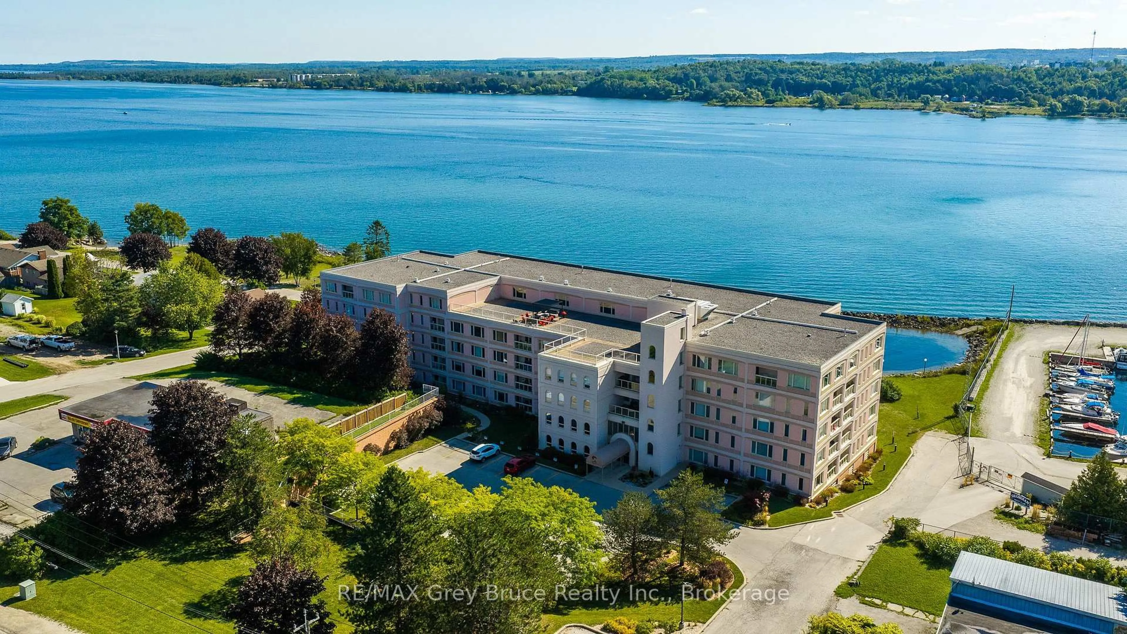 A pic from outside/outdoor area/front of a property/back of a property/a pic from drone, water/lake/river/ocean view for 2555 3rd Ave #310, Owen Sound Ontario N4K 6T8