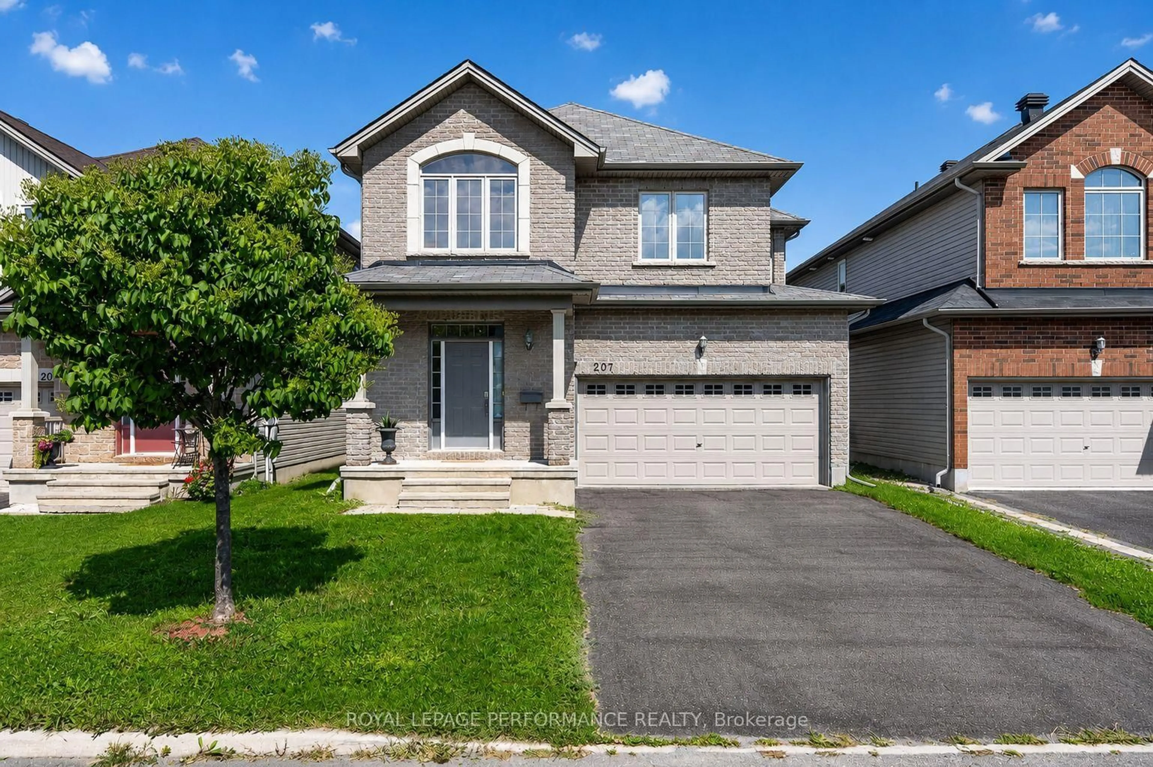 Home with vinyl exterior material, street for 207 Dave Smith Cres, Ottawa Ontario K4M 0B7