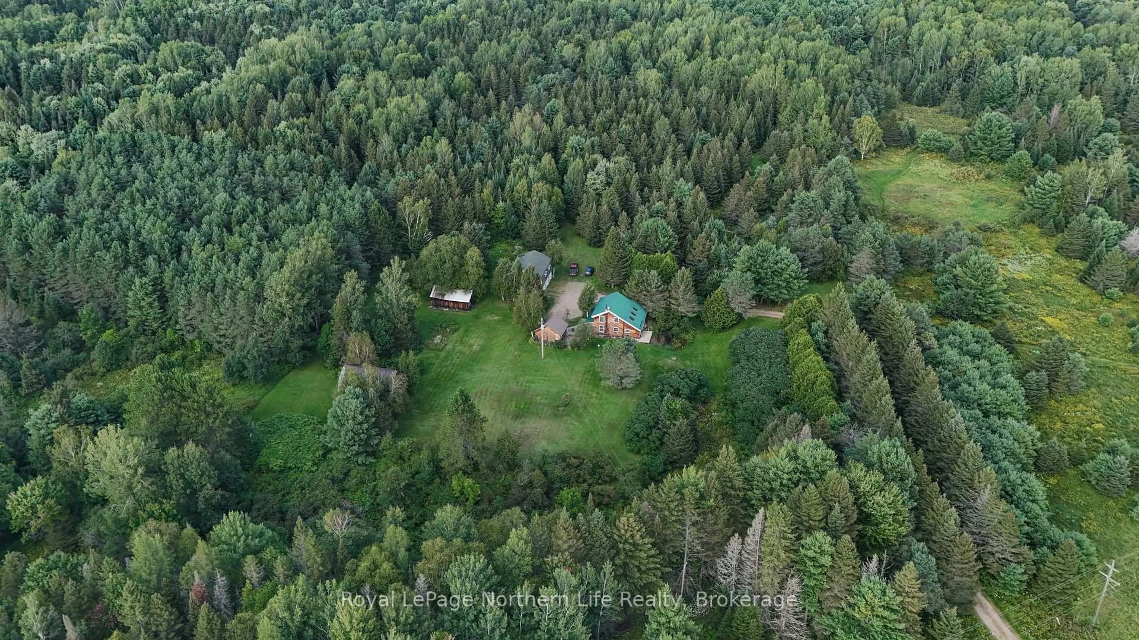 A pic from outside/outdoor area/front of a property/back of a property/a pic from drone, forest/trees view for 9609 Highway 17, Calvin Ontario P0H 1H0