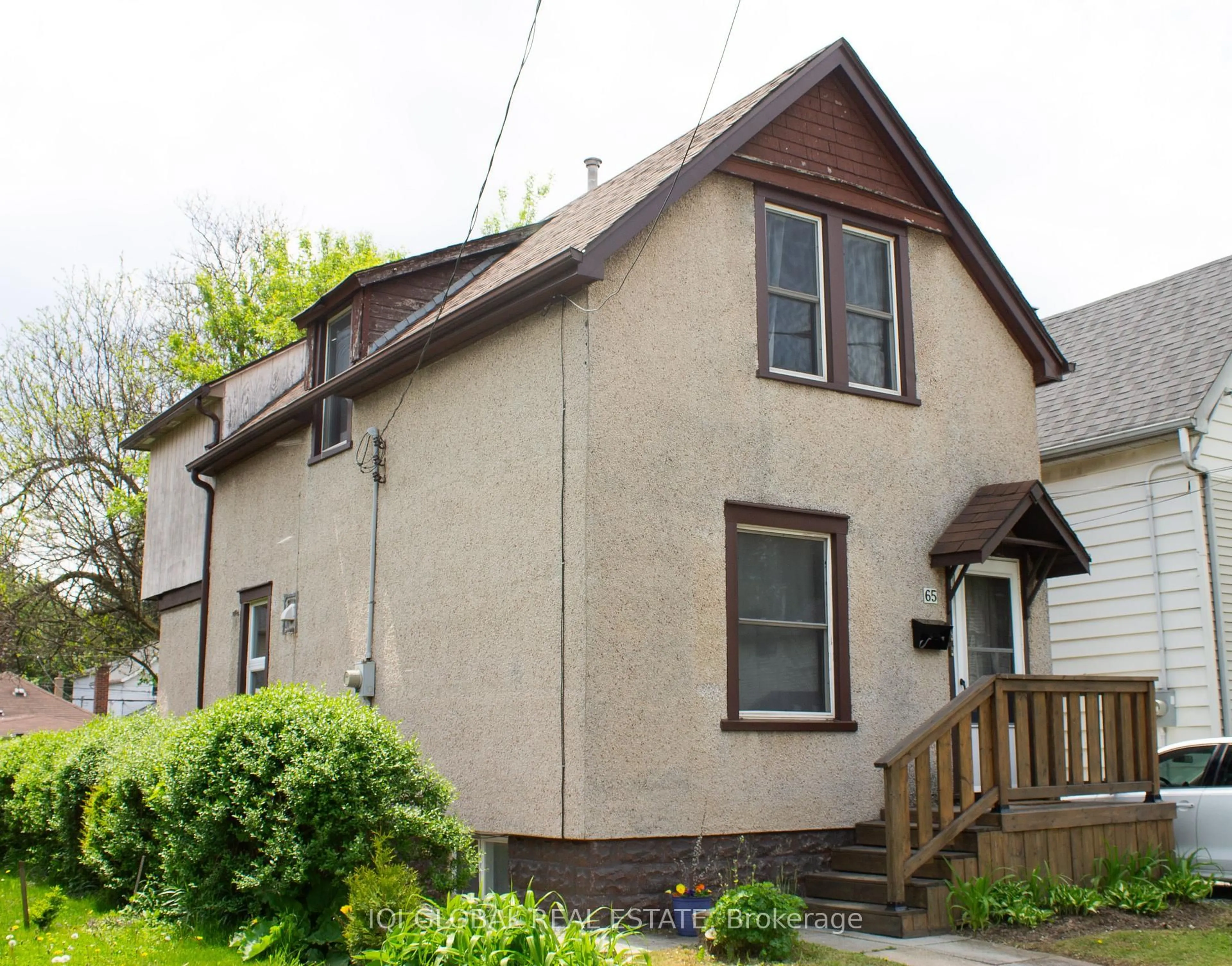 Home with vinyl exterior material, street for 65 Holmes Ave, Hamilton Ontario L8S 2K8