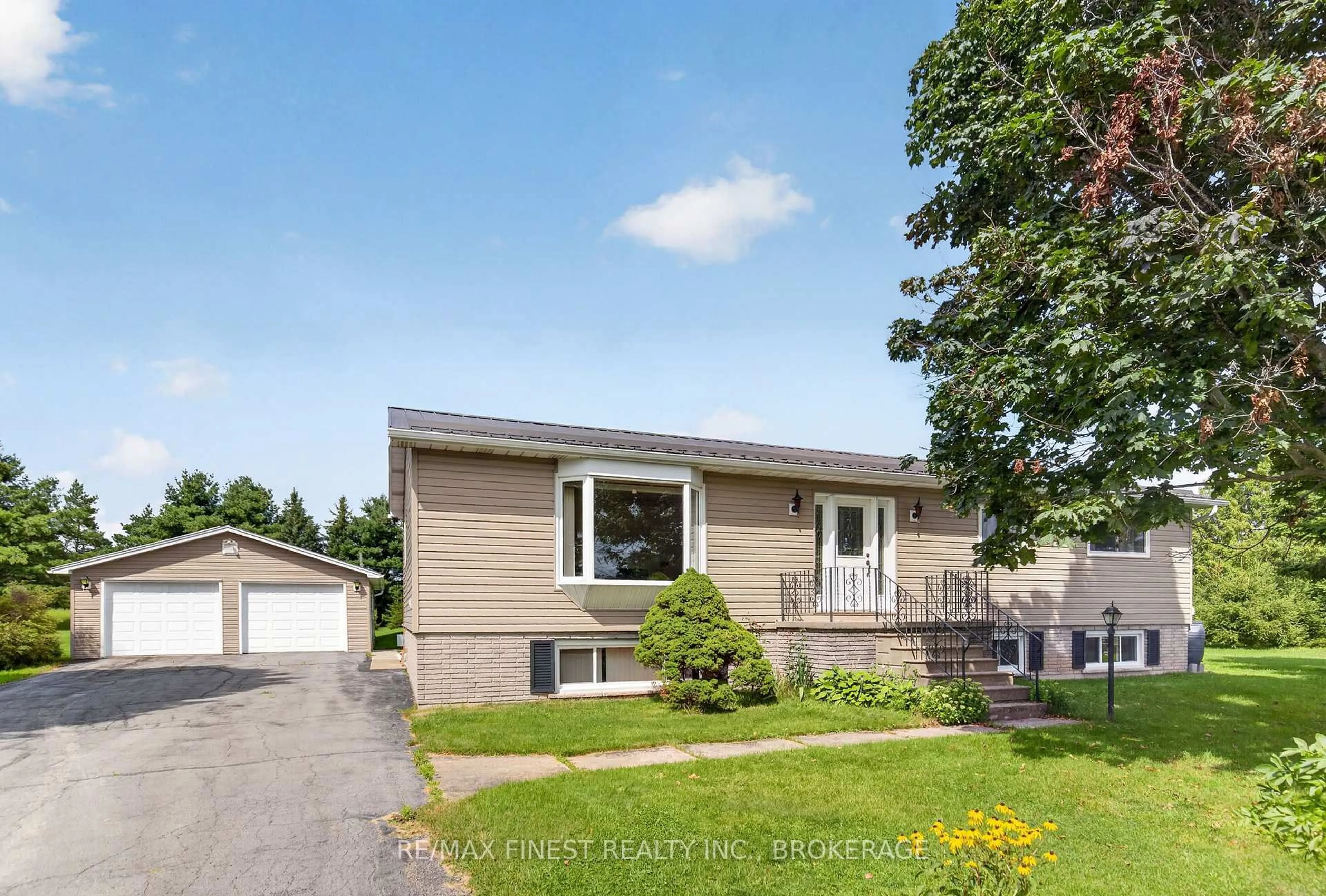 Home with vinyl exterior material, street for 3005 Wilson Rd, Harrowsmith Ontario K0H 1V0
