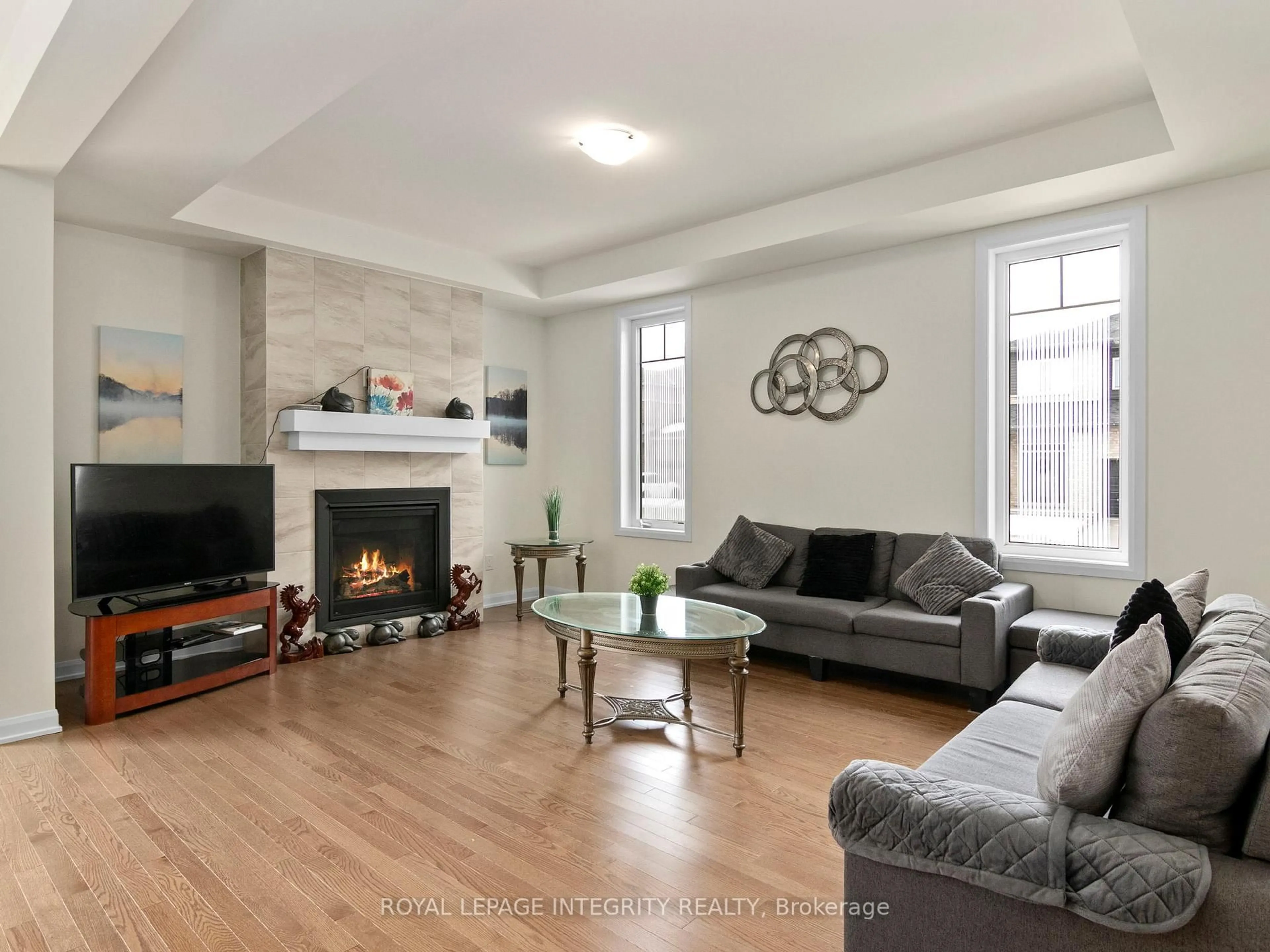 Living room with furniture, wood/laminate floor for 168 Maynooth Crt, Ottawa Ontario K2J 6Y5