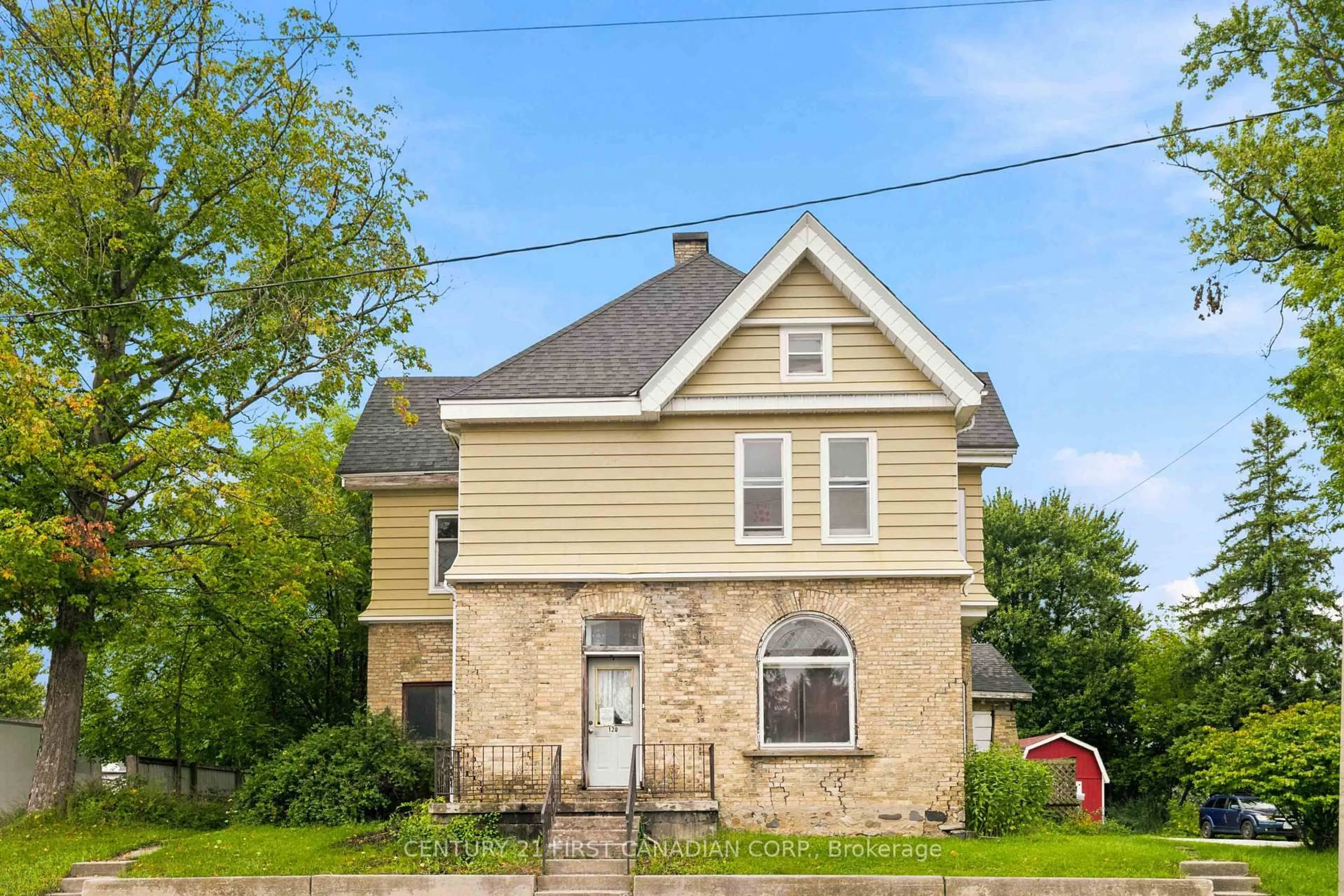Home with brick exterior material, building for 128 Main St, Lucan Biddulph Ontario N0M 2J0