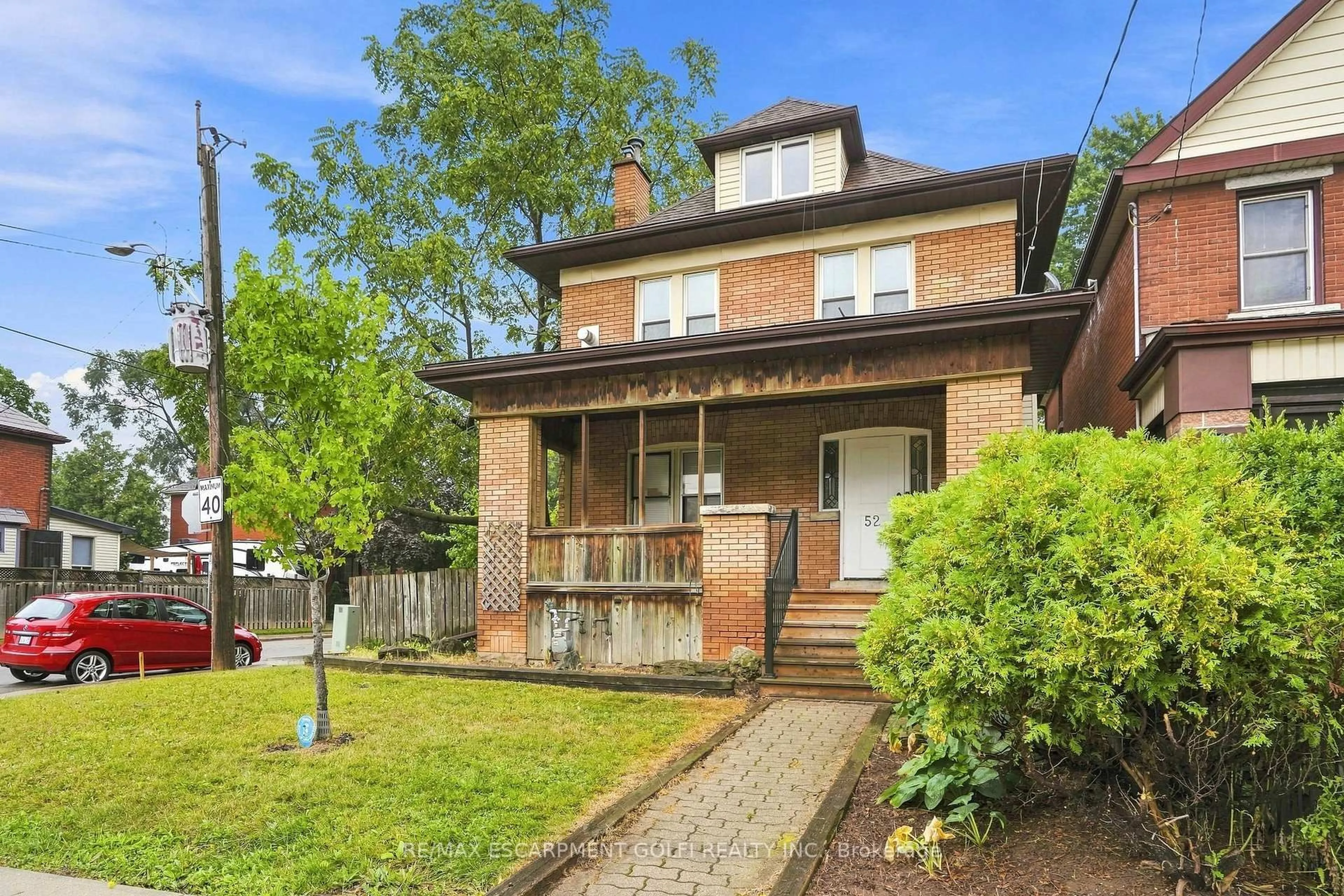Home with brick exterior material, street for 52 Kensington Ave, Hamilton Ontario L8L 7M9