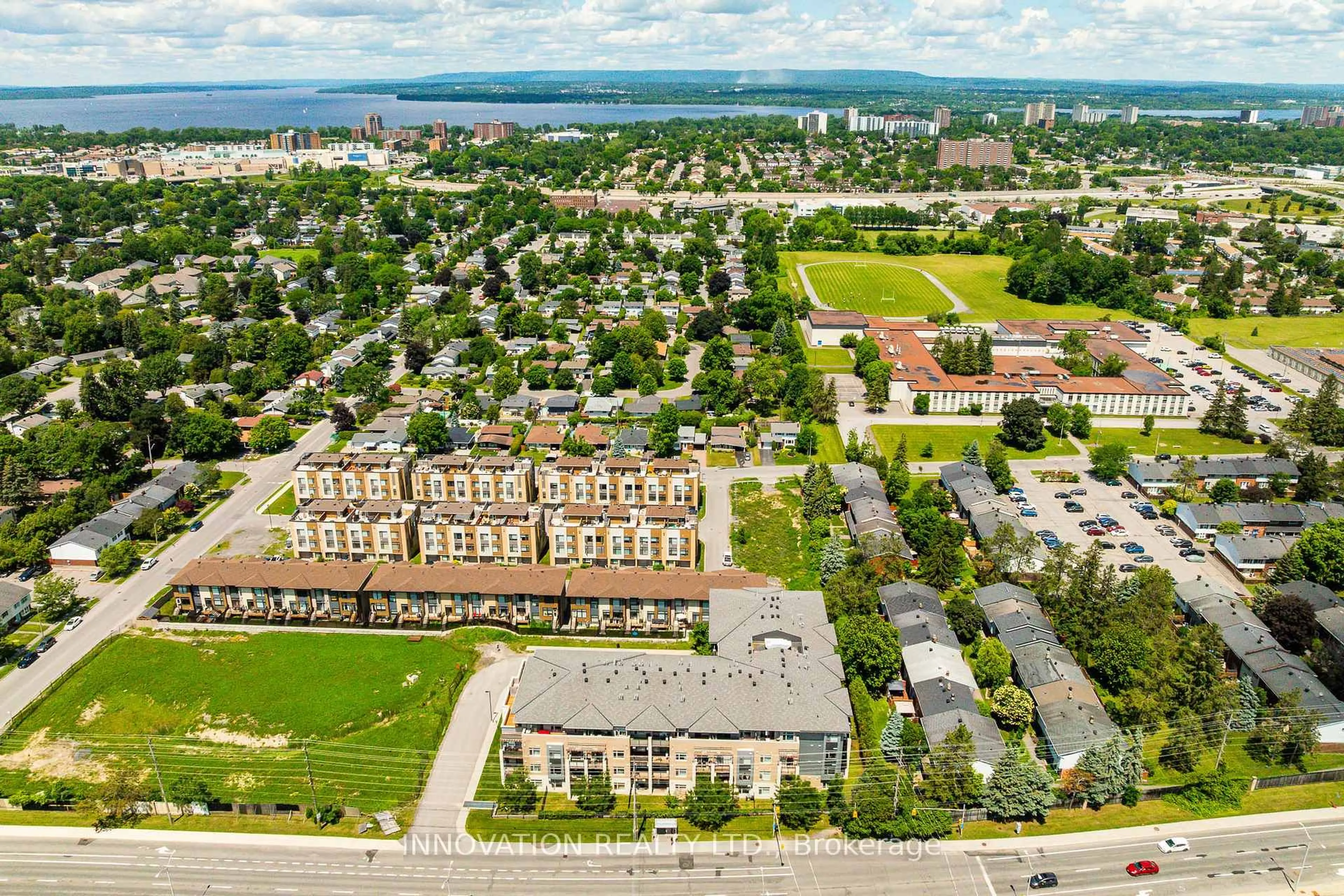 A pic from outside/outdoor area/front of a property/back of a property/a pic from drone, unknown for 2785 Baseline Rd #311, Ottawa Ontario K2H 0B7