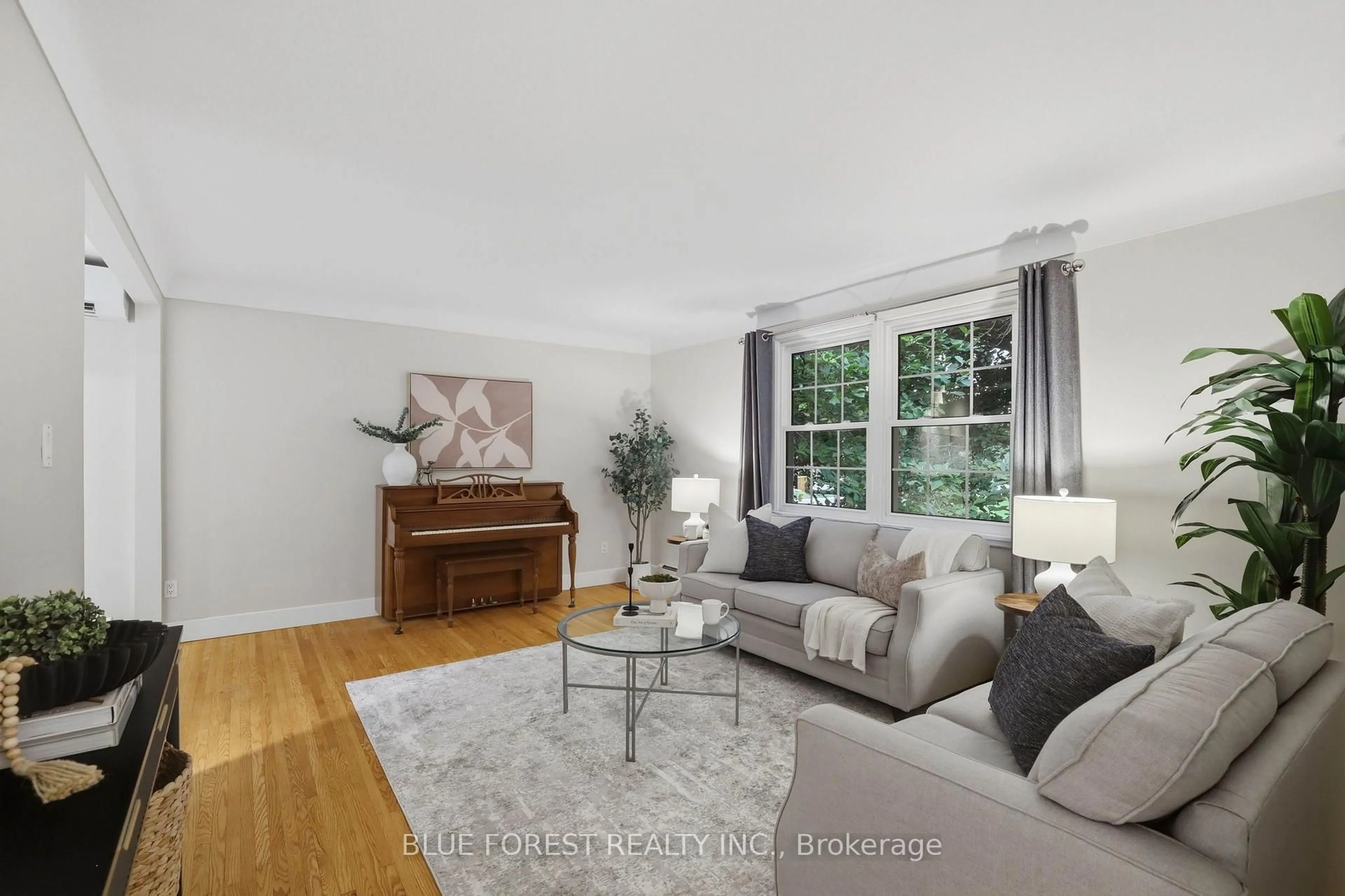 Living room with furniture, wood/laminate floor for 111 Arthur St, Middlesex Centre Ontario N0L 1R0