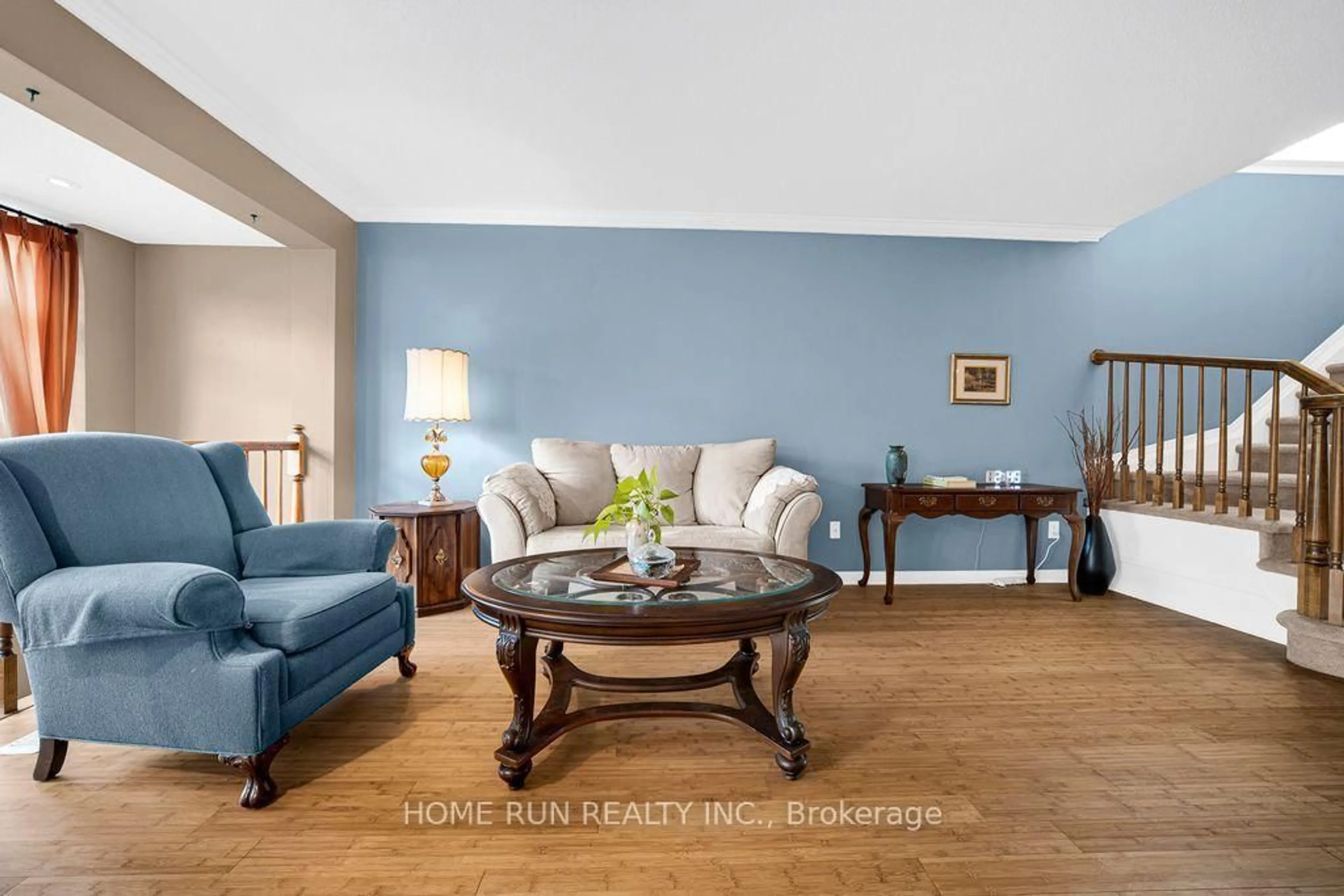 Living room with furniture, wood/laminate floor for 417 Wisteria Cres, Ottawa Ontario K1V 0P1