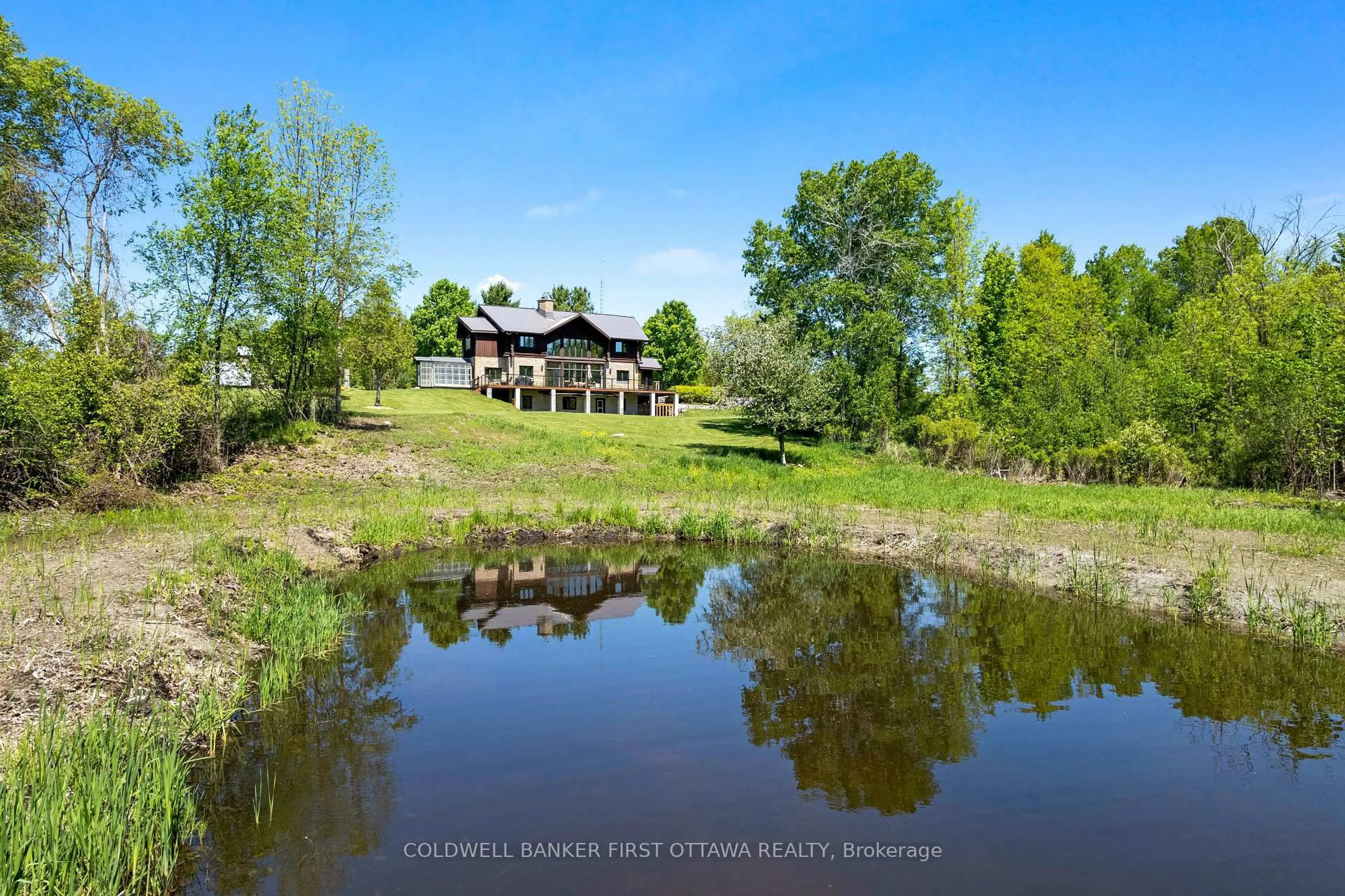 A pic from outside/outdoor area/front of a property/back of a property/a pic from drone, water/lake/river/ocean view for 19067 Highway 7, Perth Ontario K7H 3C6