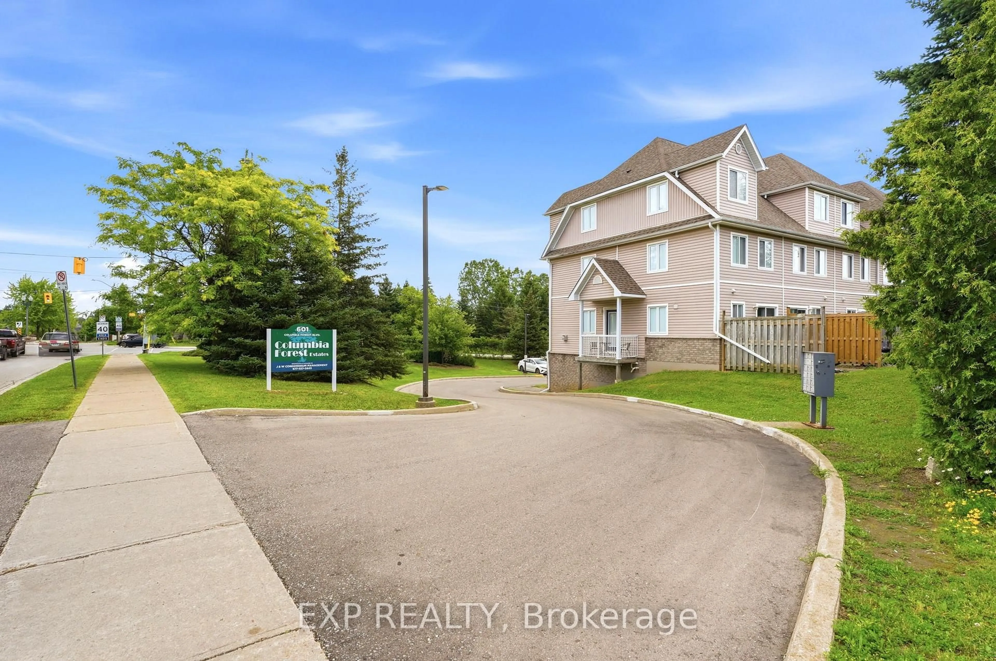 A pic from outside/outdoor area/front of a property/back of a property/a pic from drone, street for 601 Columbia Forest Blvd #3, Waterloo Ontario N2V 2K7
