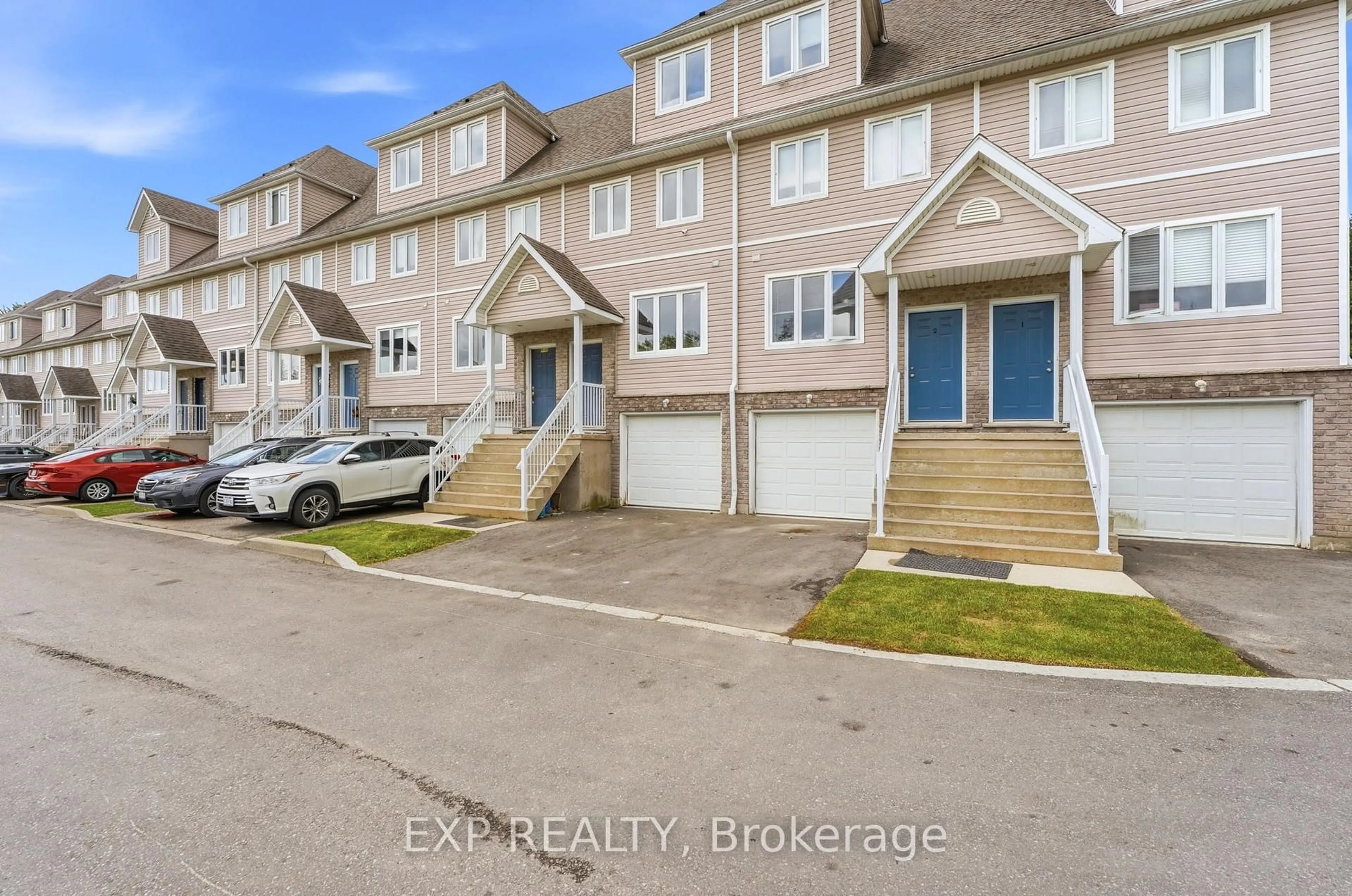 A pic from outside/outdoor area/front of a property/back of a property/a pic from drone, street for 601 Columbia Forest Blvd #3, Waterloo Ontario N2V 2K7