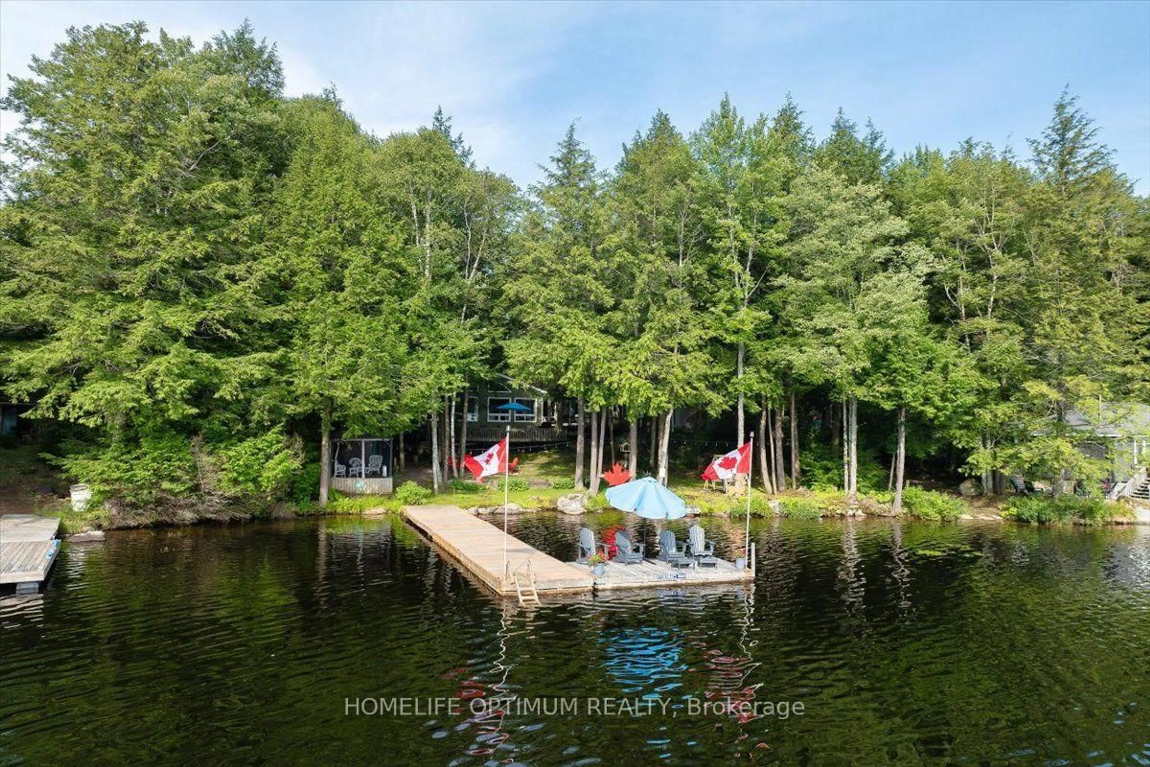 A pic from outside/outdoor area/front of a property/back of a property/a pic from drone, water/lake/river/ocean view for 1195 Lakeshore Dr, Bracebridge Ontario P1L 1X3