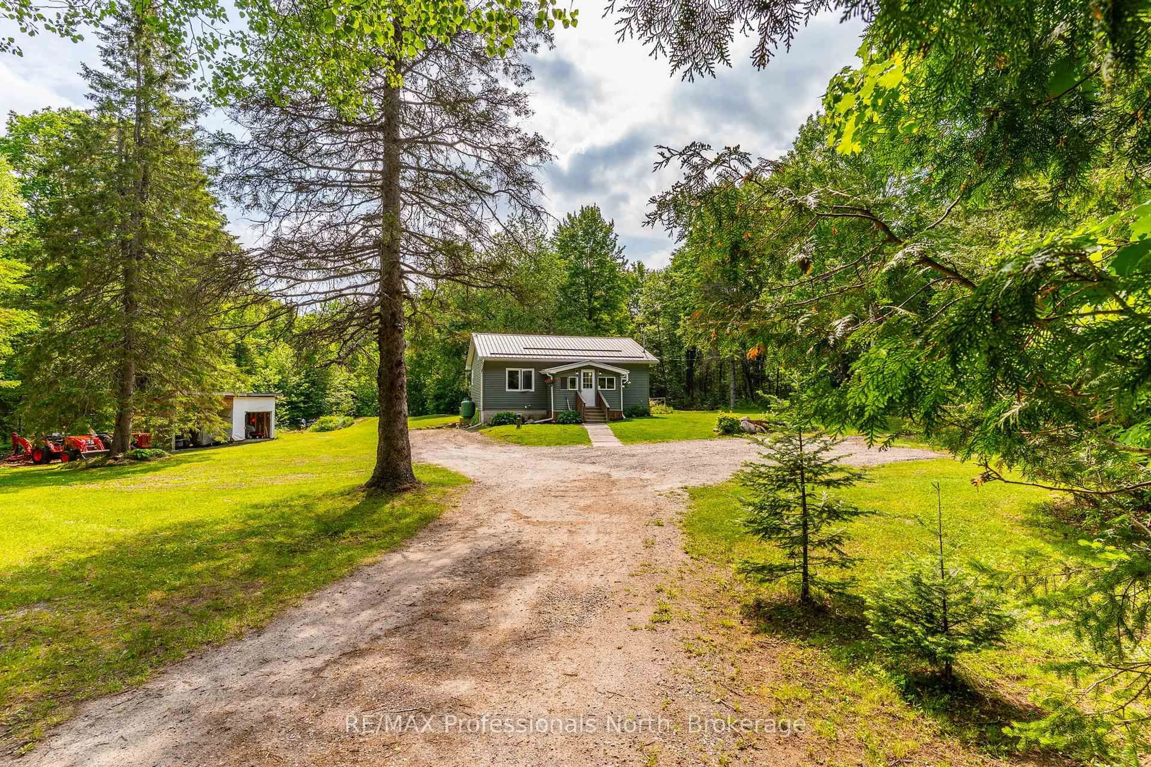 A pic from outside/outdoor area/front of a property/back of a property/a pic from drone, forest/trees view for 17900 Highway 118, Highlands East Ontario K0L 2Y0
