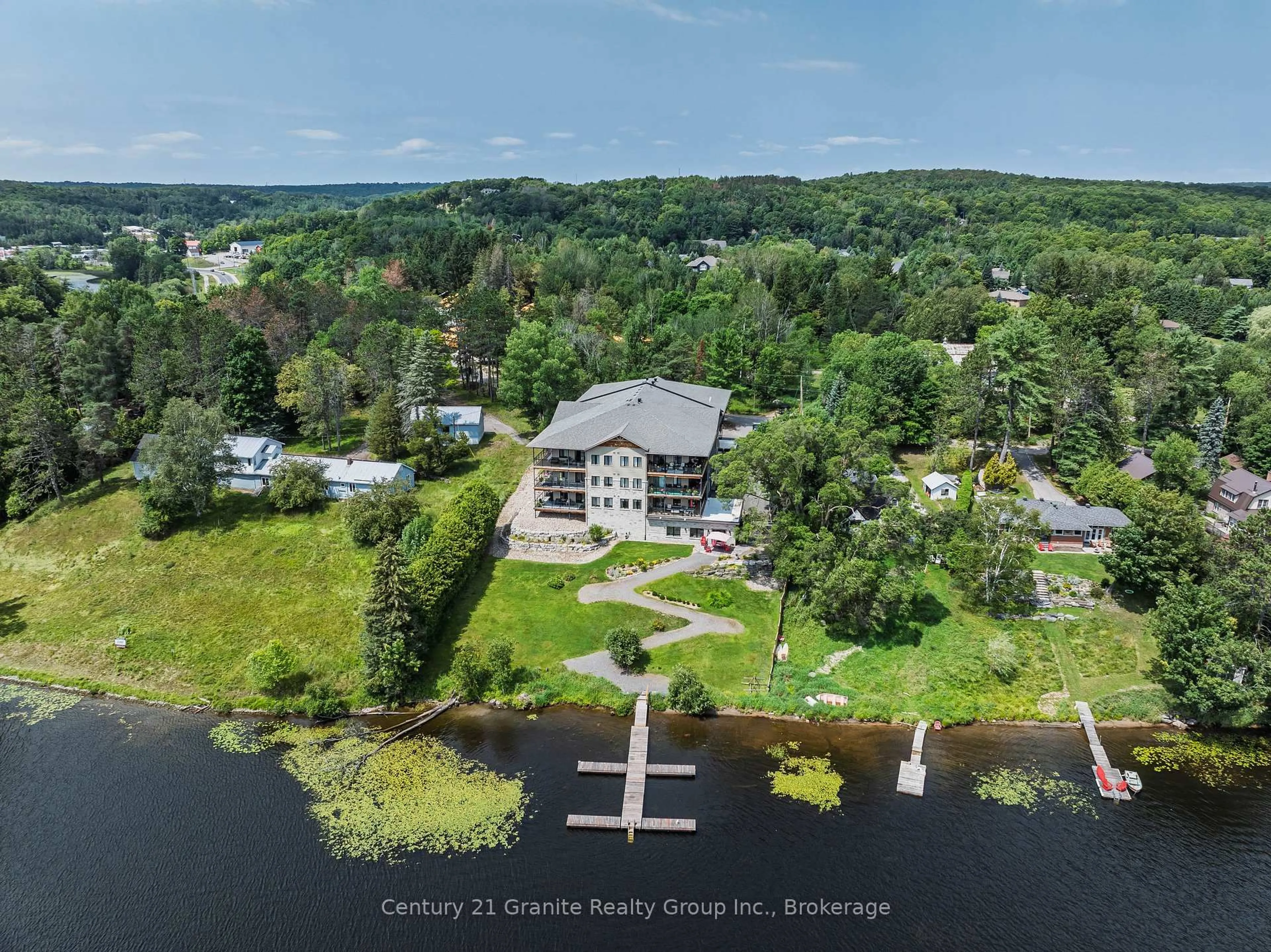 A pic from outside/outdoor area/front of a property/back of a property/a pic from drone, water/lake/river/ocean view for 75 Wallings Rd #105, Dysart et al Ontario K0M 1S0