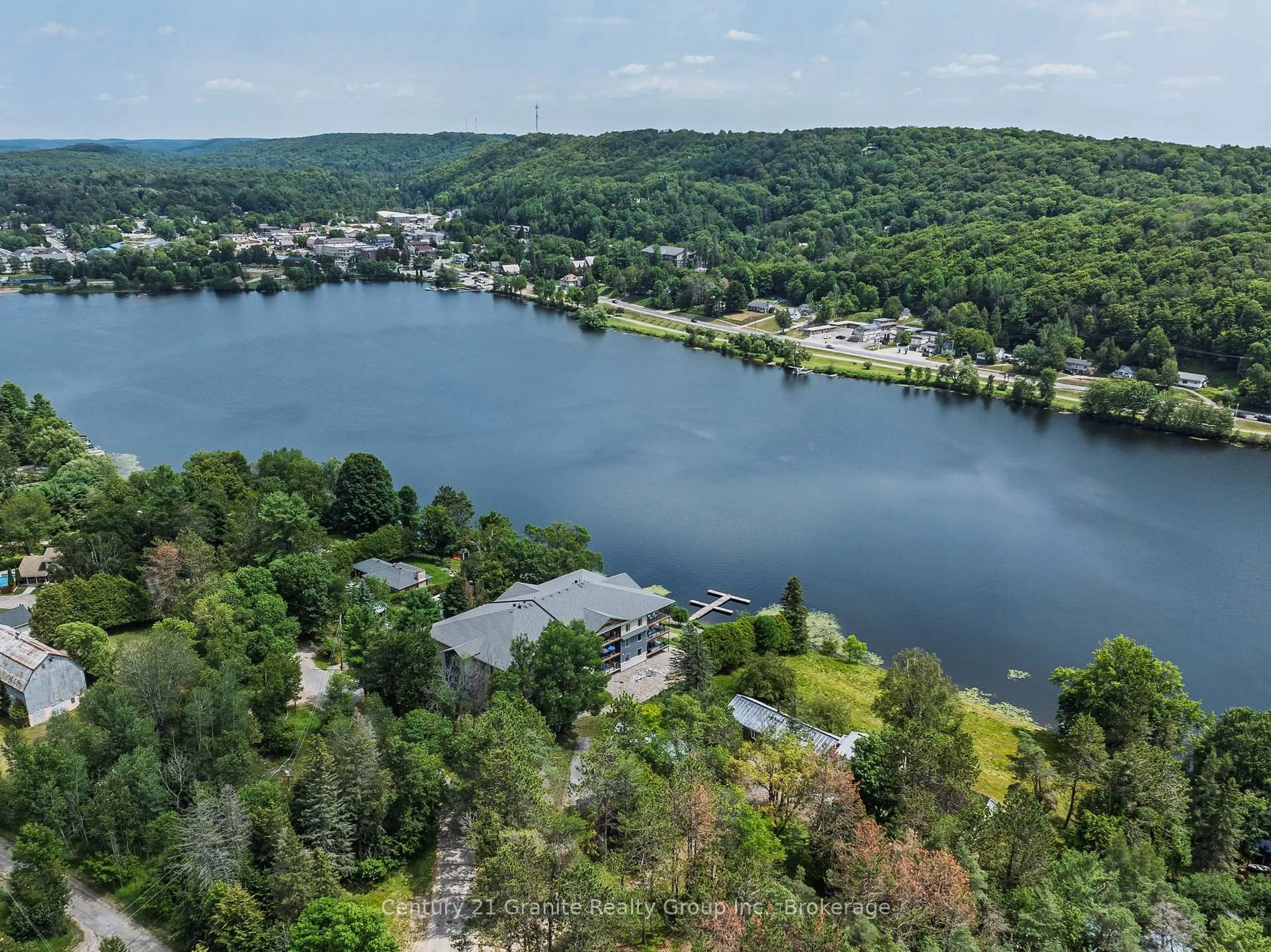 A pic from outside/outdoor area/front of a property/back of a property/a pic from drone, water/lake/river/ocean view for 75 Wallings Rd #105, Dysart et al Ontario K0M 1S0