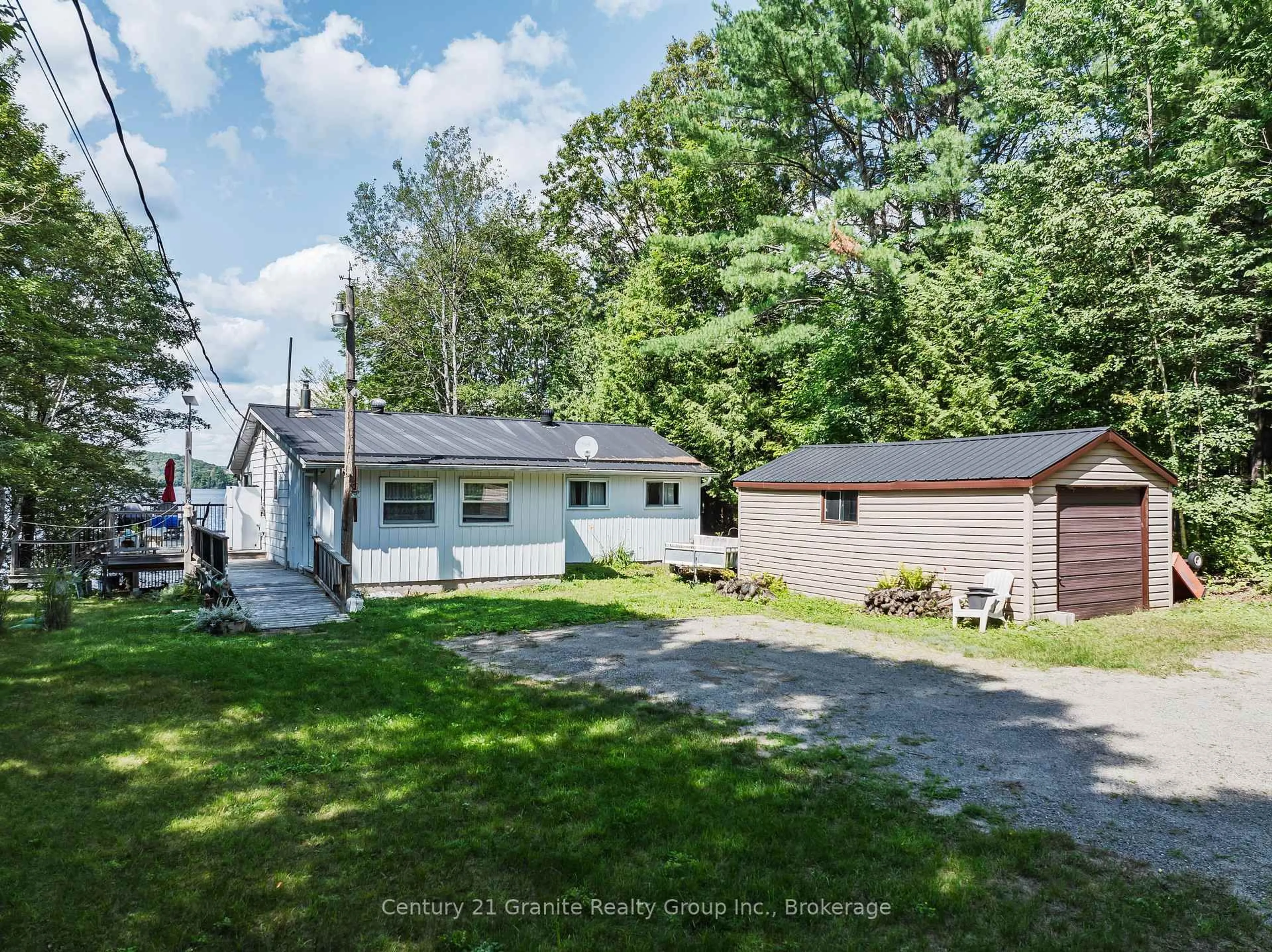 A pic from outside/outdoor area/front of a property/back of a property/a pic from drone, street for 1401 Hodgson Rd, Dysart et al Ontario K0M 1S0