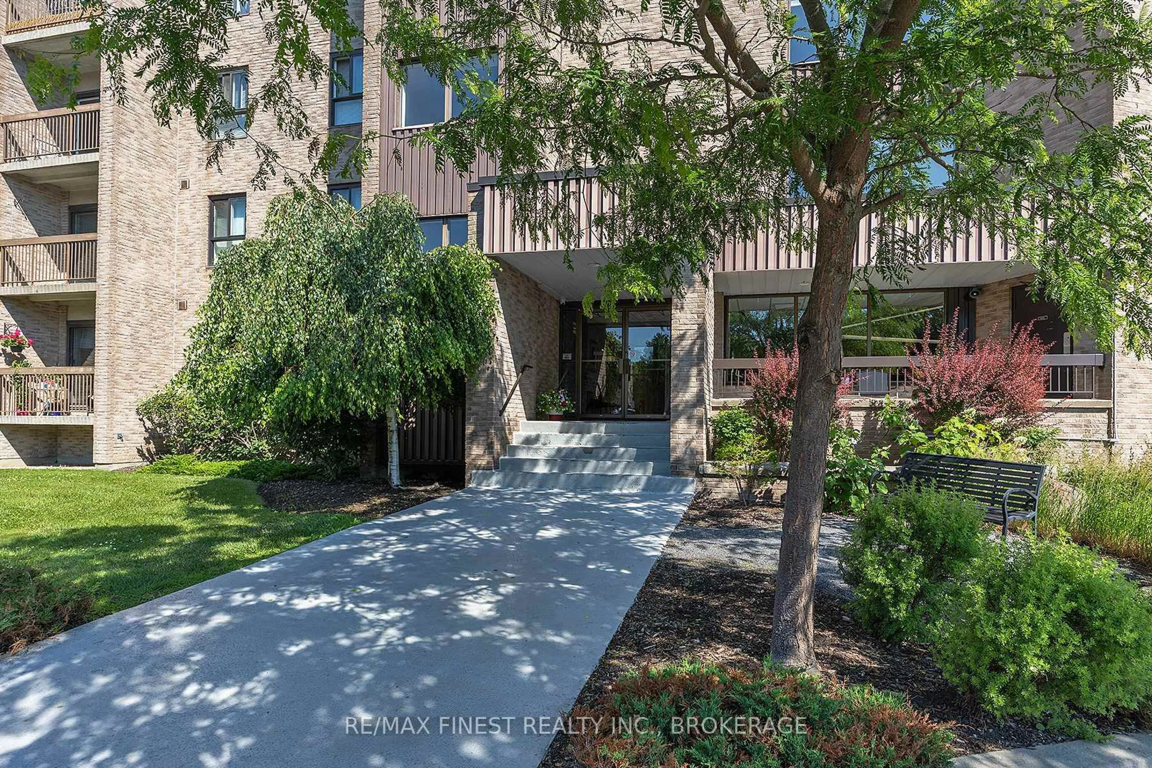 A pic from outside/outdoor area/front of a property/back of a property/a pic from drone, street for 334 Queen Mary Rd #408, Kingston Ontario K7M 7E7