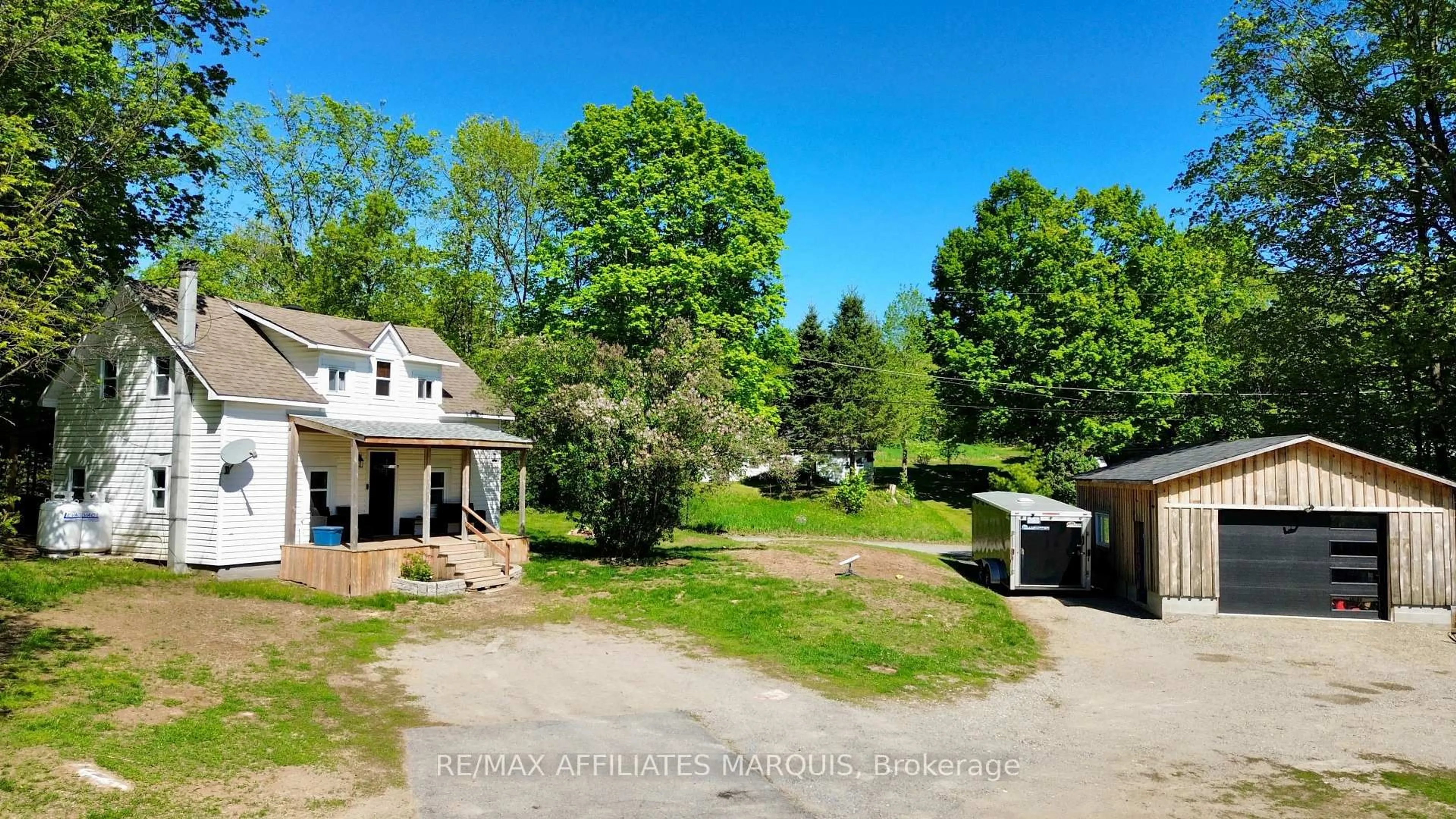 A pic from outside/outdoor area/front of a property/back of a property/a pic from drone, unknown for 14702 38 Rd, Sharbot Lake Ontario K0H 2P0