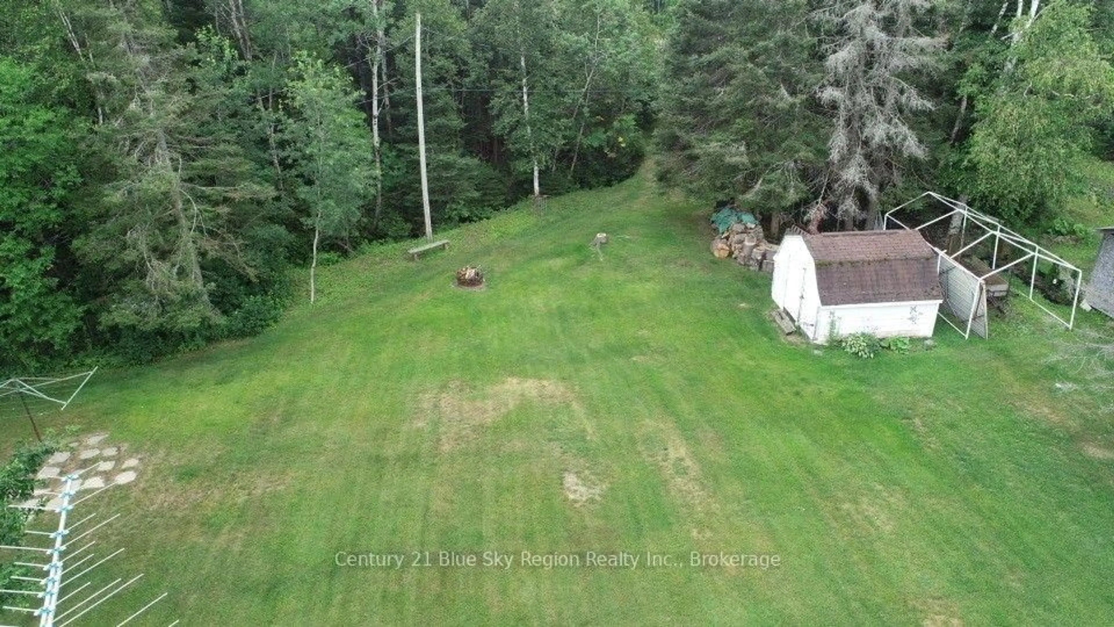 A pic from outside/outdoor area/front of a property/back of a property/a pic from drone, forest/trees view for 5377 Highway 11, North Bay Ontario P1B 8G3