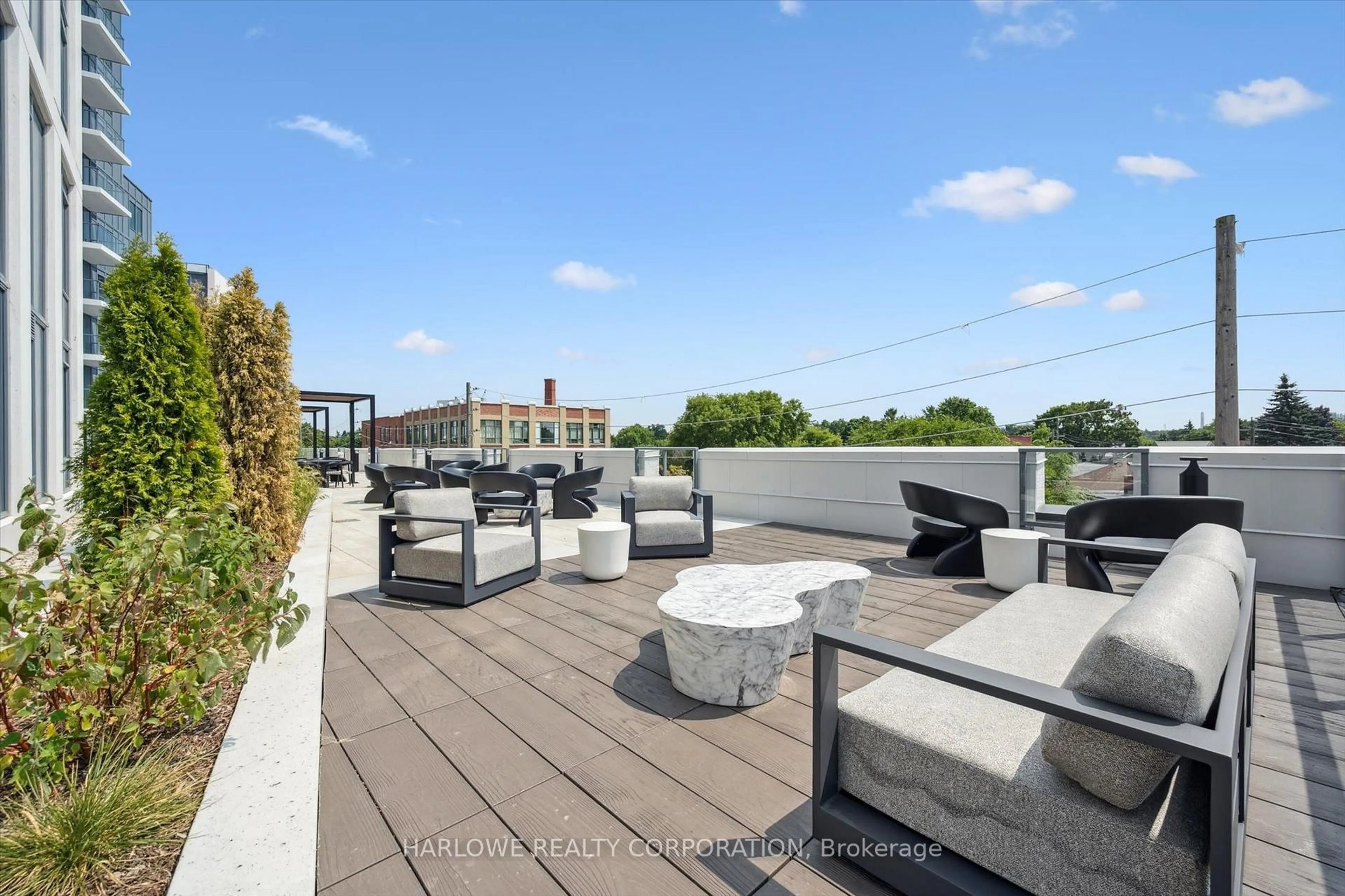 Patio, city buildings view from balcony for 93 Arthur St #501, Guelph Ontario N1E 0T3