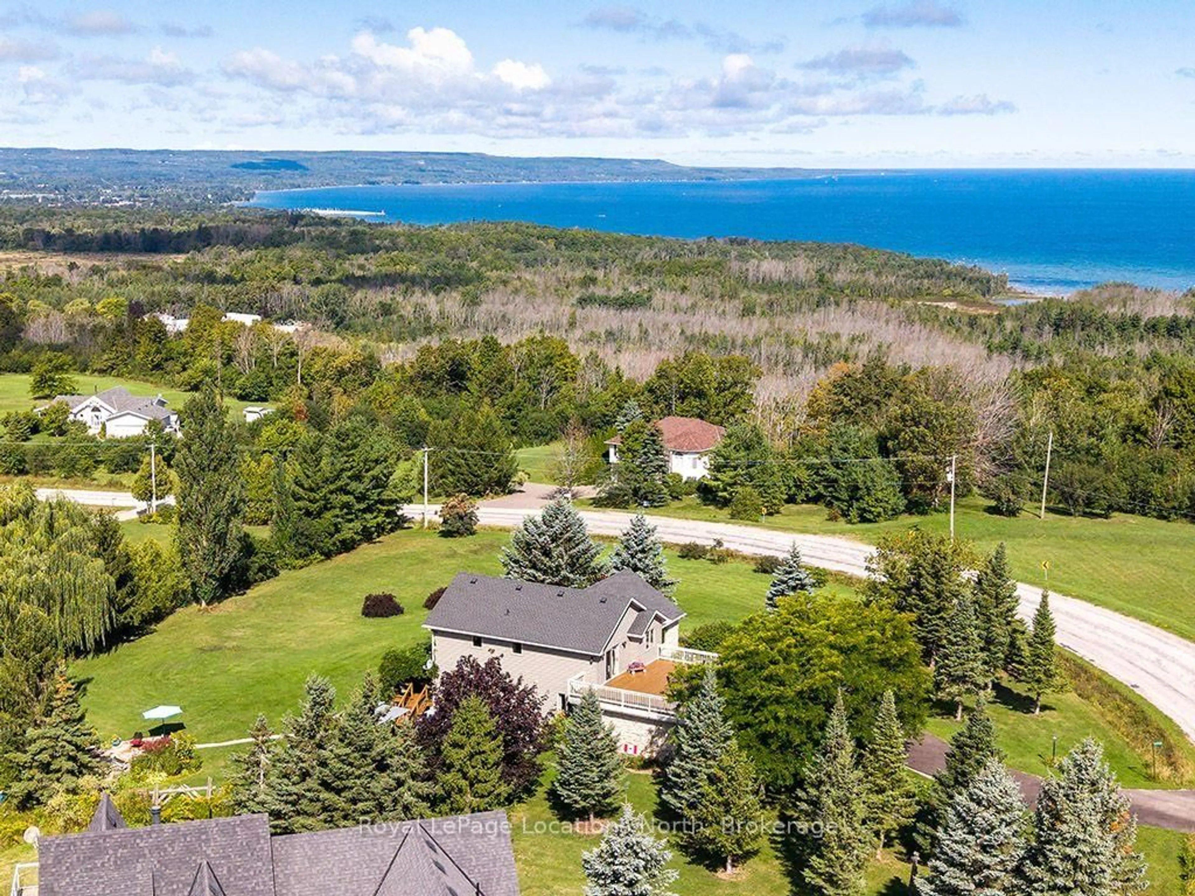 A pic from outside/outdoor area/front of a property/back of a property/a pic from drone, water/lake/river/ocean view for 317624 3rd Line, Meaford Ontario N4L 1W7