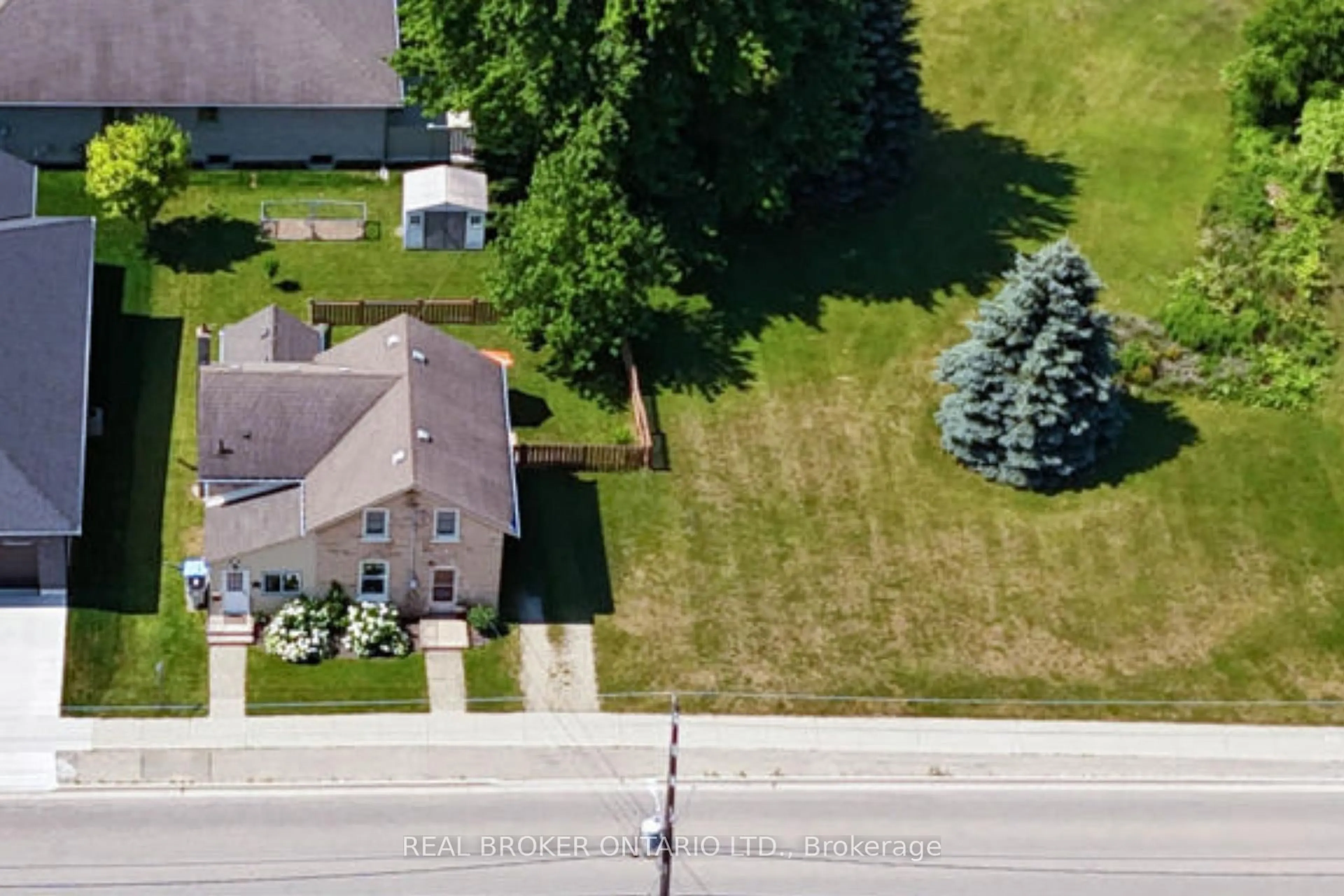 A pic from outside/outdoor area/front of a property/back of a property/a pic from drone, street for 520 Elma St, North Perth Ontario N4W 1W3