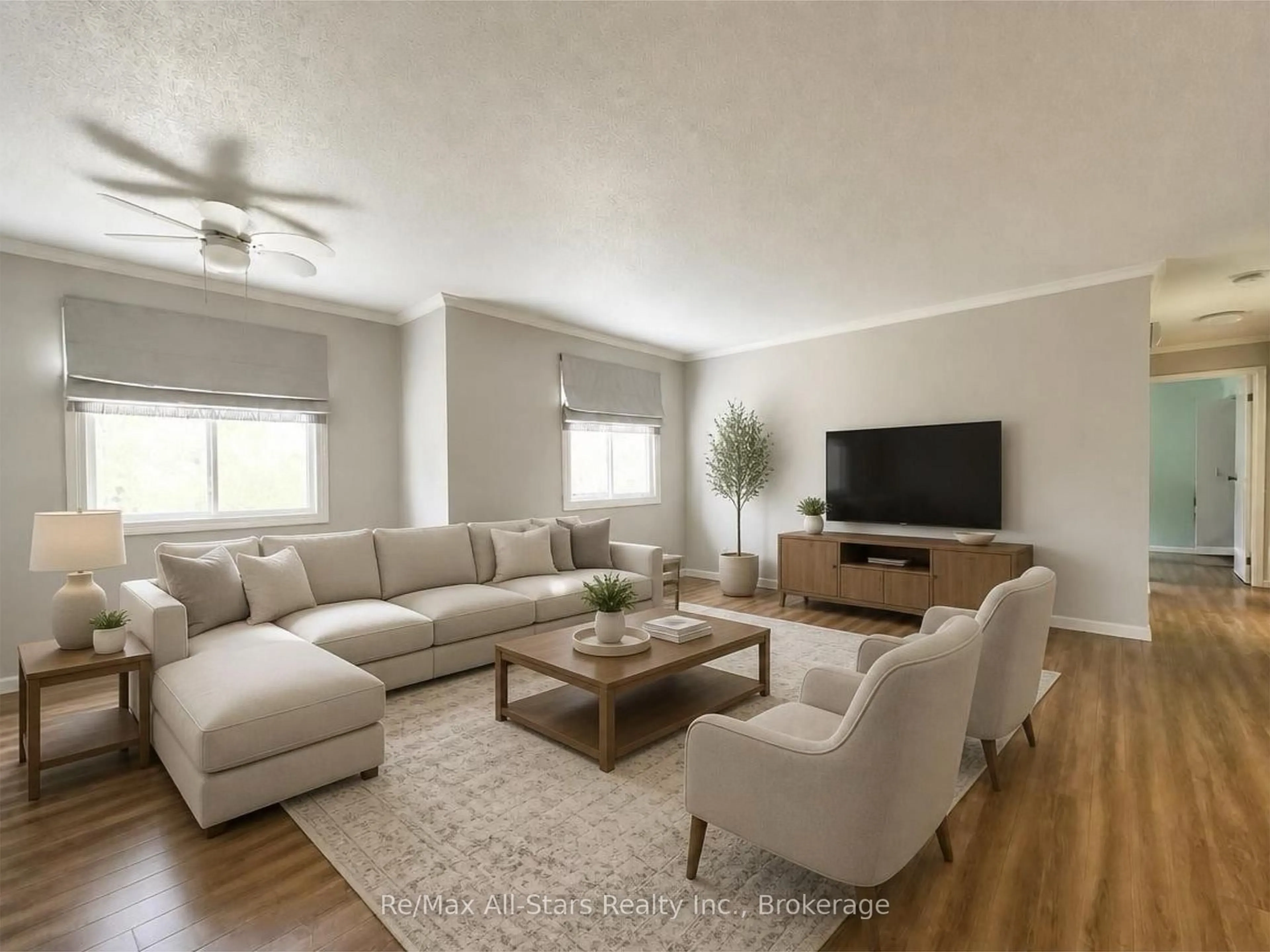 Living room with furniture, wood/laminate floor for 15 Clifton St #101, Kawartha Lakes Ontario K0M 1N0