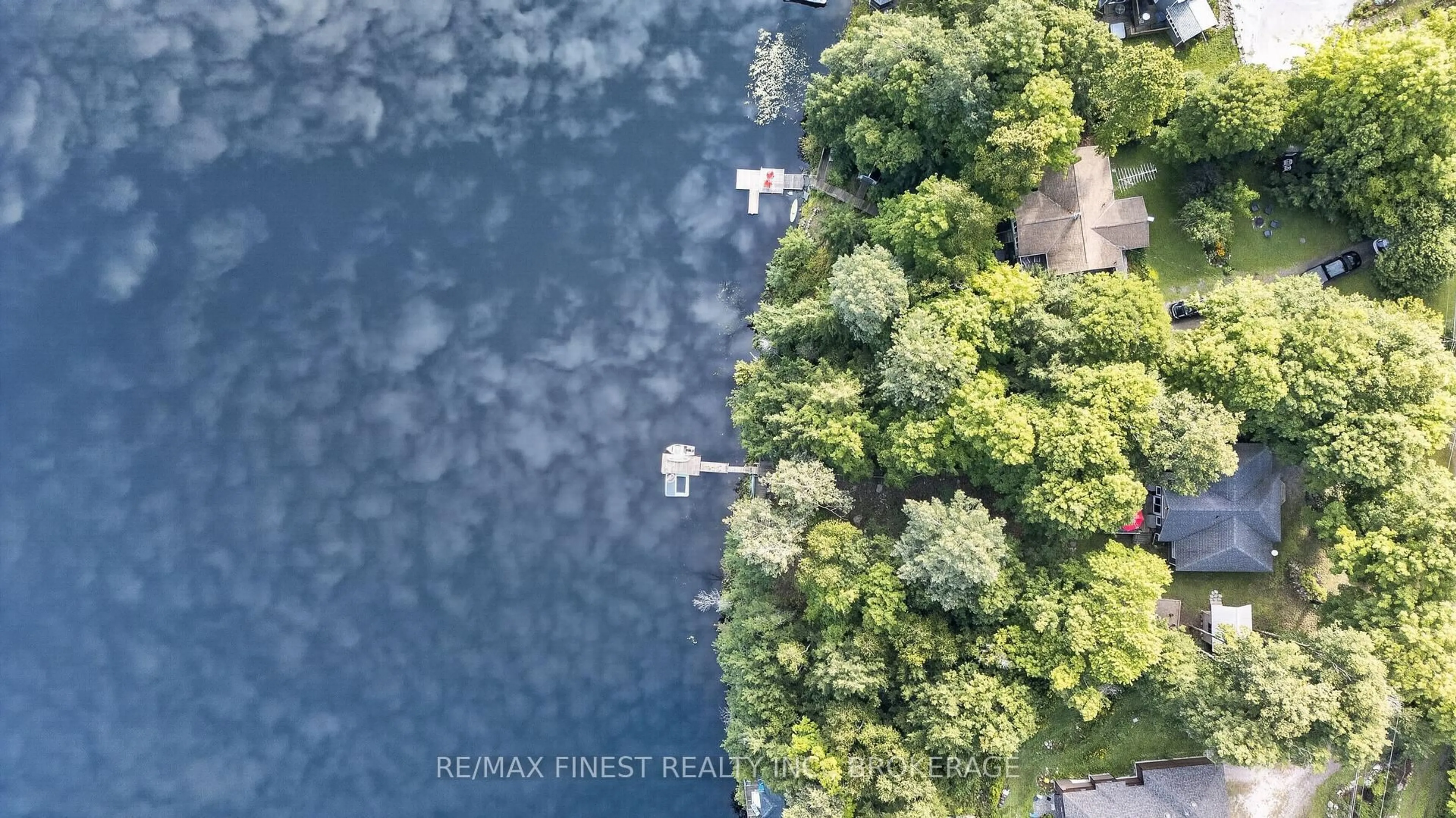 A pic from outside/outdoor area/front of a property/back of a property/a pic from drone, water/lake/river/ocean view for 1068 Pleasant Hill Lane, Arden Ontario K0H 1B0