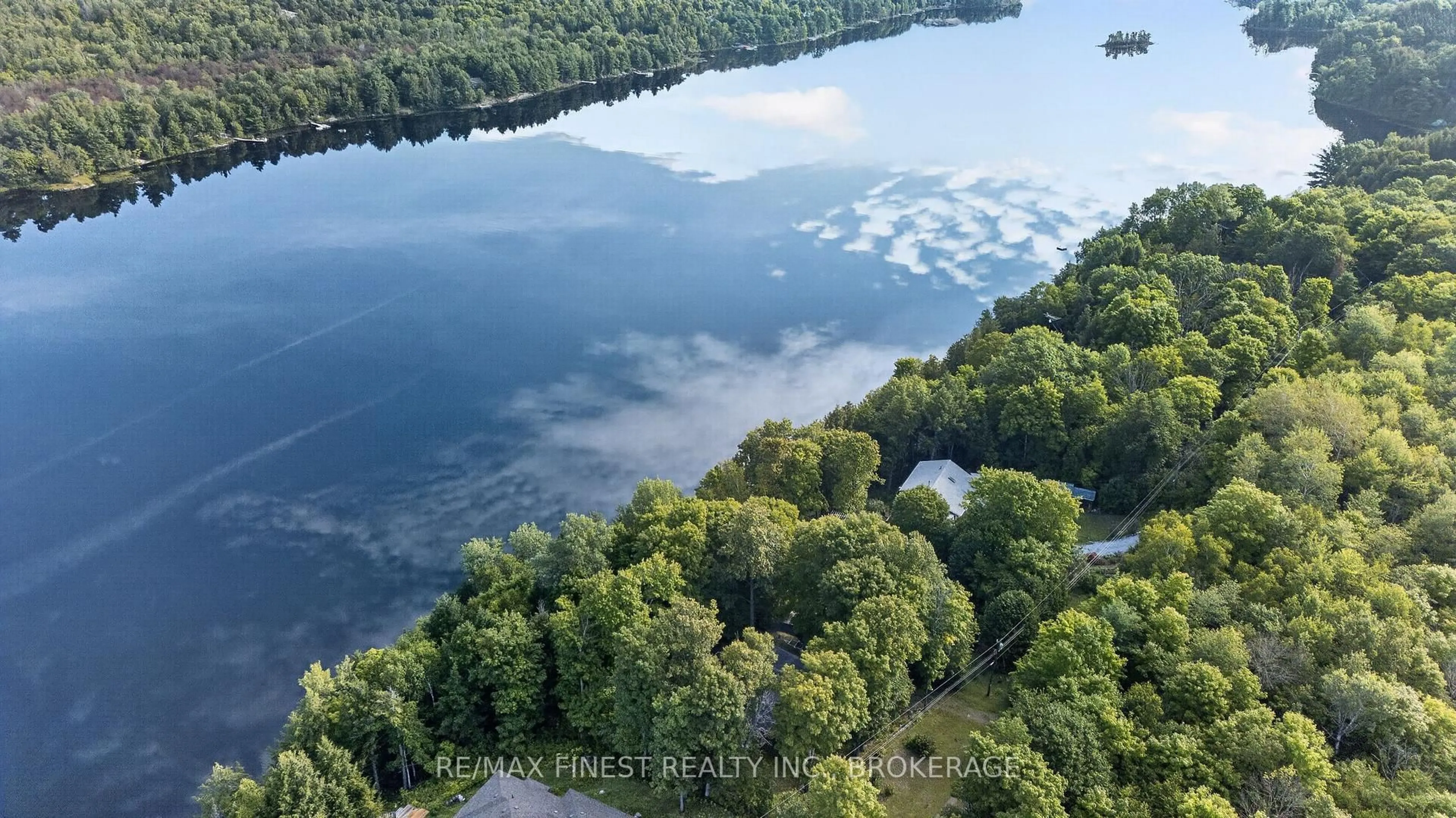 A pic from outside/outdoor area/front of a property/back of a property/a pic from drone, water/lake/river/ocean view for 1068 Pleasant Hill Lane, Arden Ontario K0H 1B0