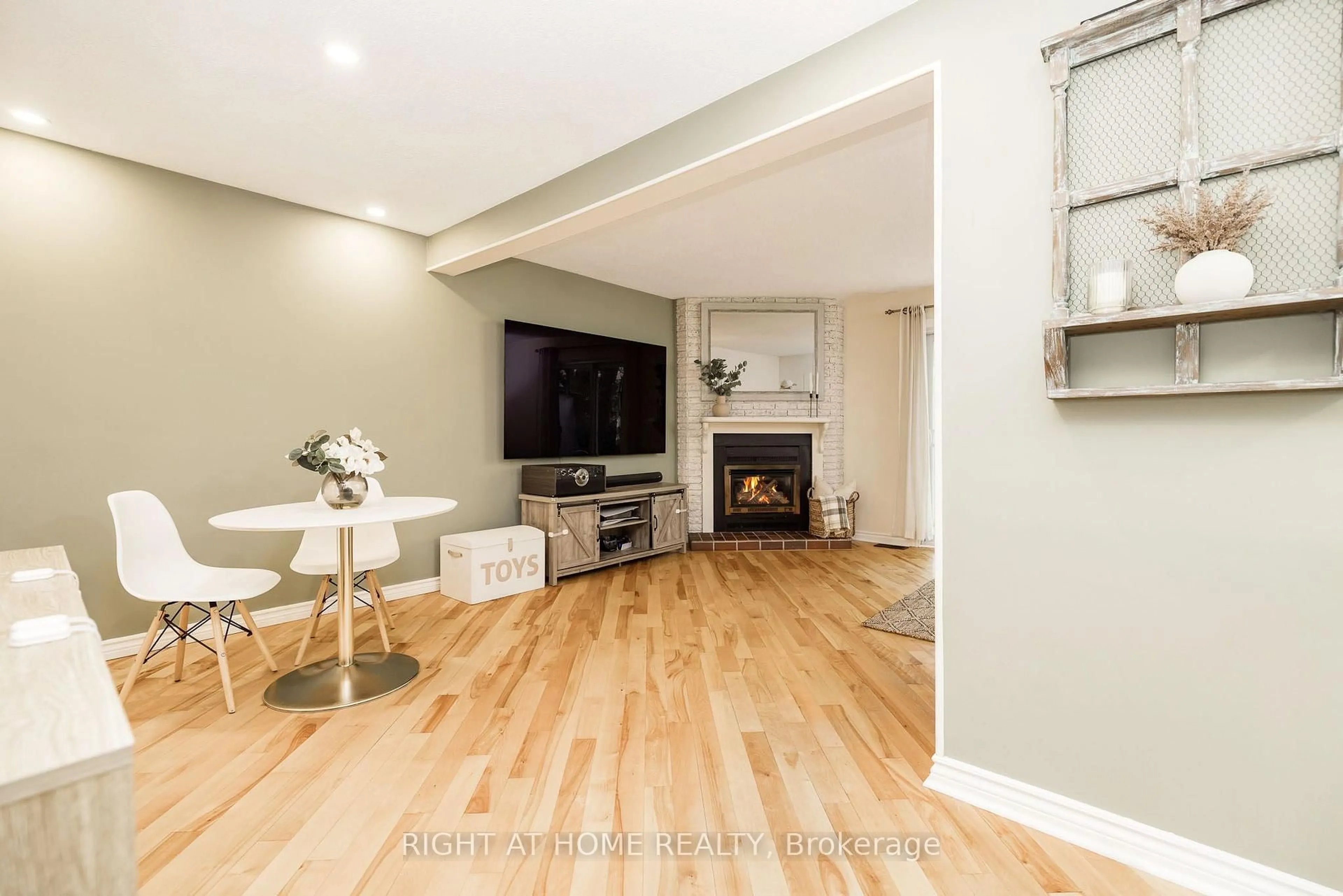 Living room with furniture, wood/laminate floor for 30 Berkshire Way, Barrhaven Ontario K2J 2B2